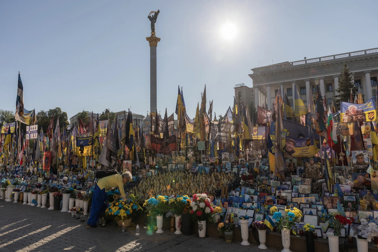 A person visits the makeshift memorial for fallen Ukrainian and foreign soldiers during the Independence Day of Ukraine, on Independence Square in Kyiv on August 24, 2026, amid the Russian invasion of Ukraine. 