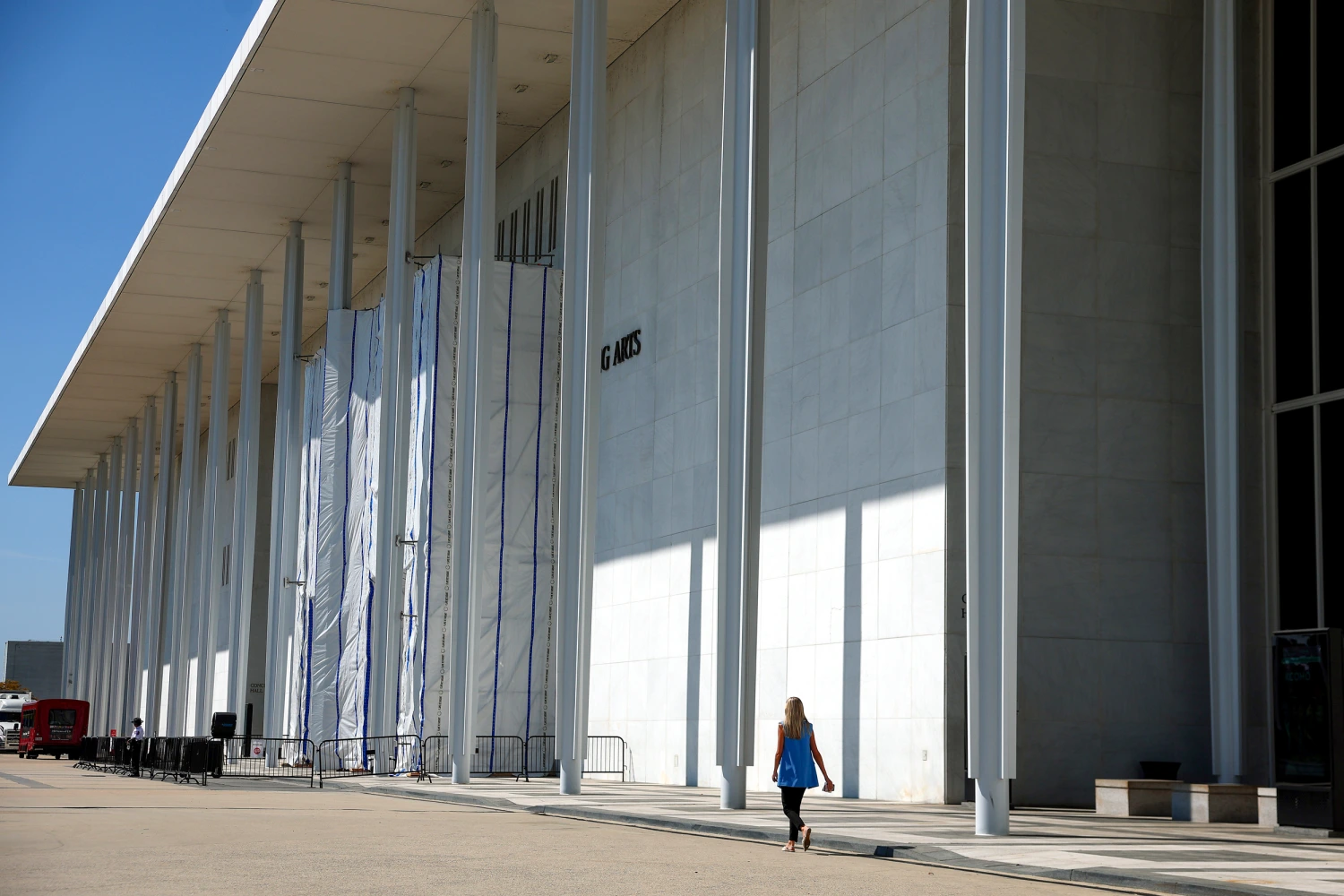 A person walks near the John F. Kennedy Center for the Performing Arts  on Aug. 25, 2026, in Washington, D.C.