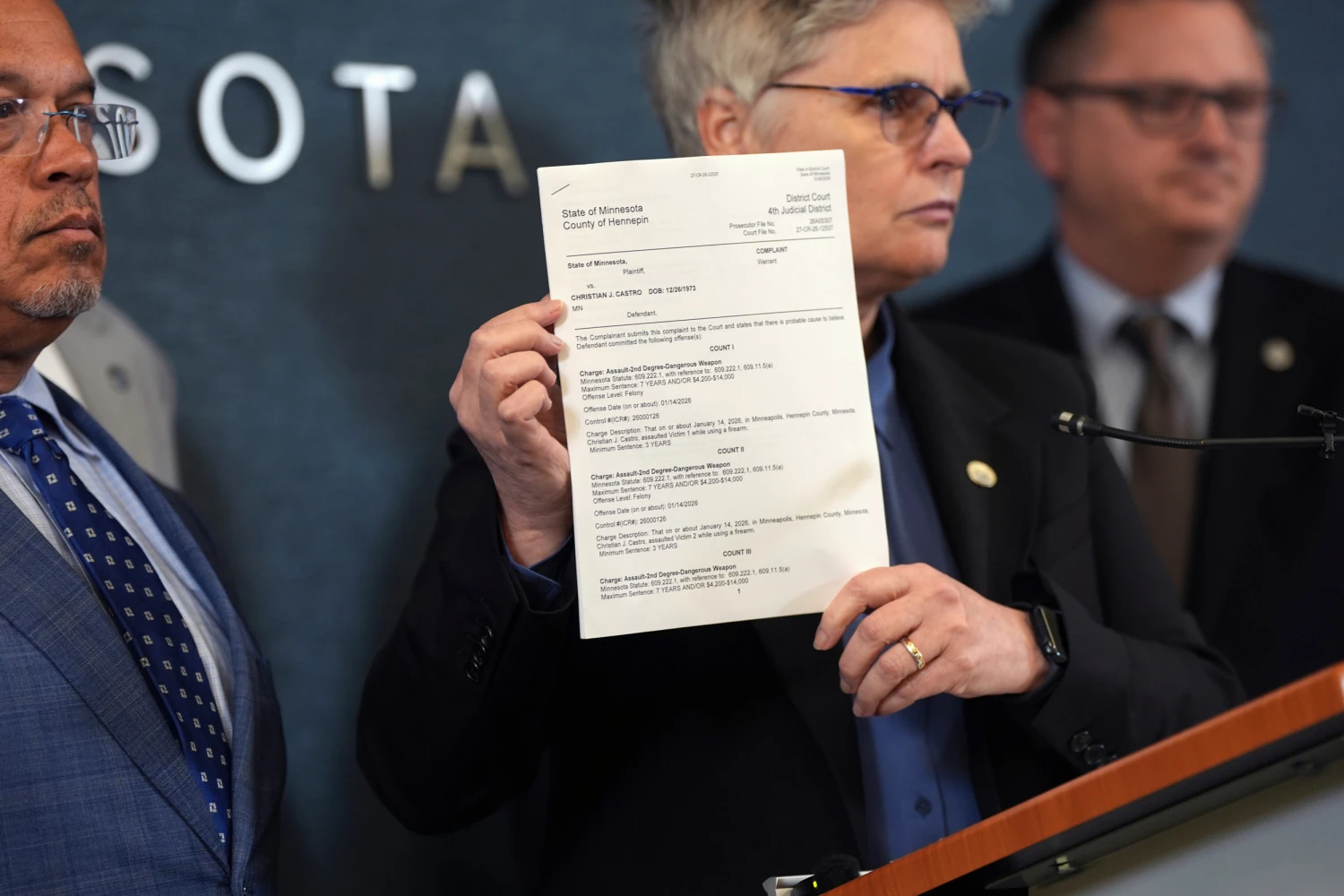 Hennepin County attorney Mary Moriarty holds up a document containing charges against ICE agent Christian Castro during a news conference at the Hennepin County Government Center in Minneapolis, on Monday, May 18, 2026.
