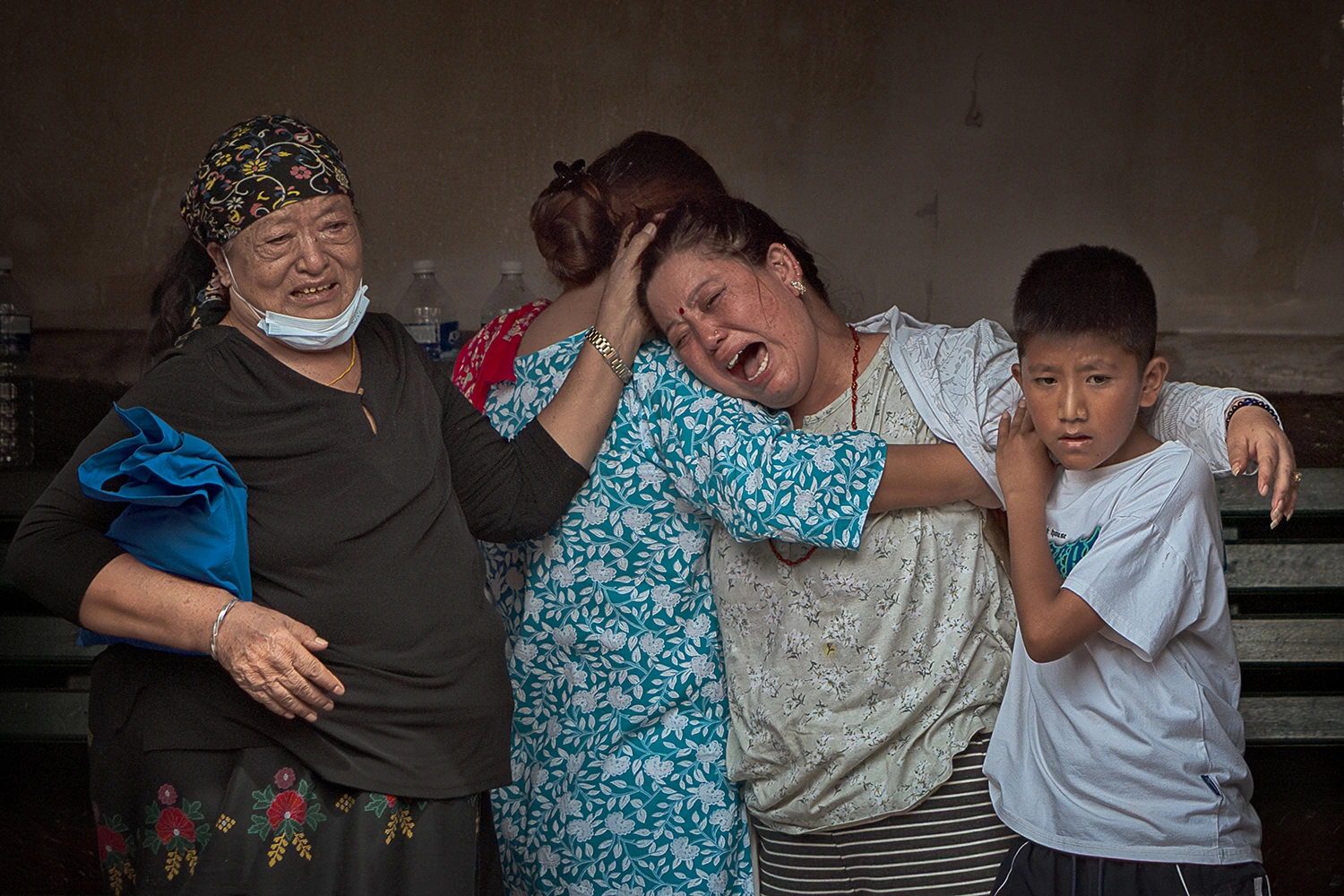 Relatives mourn during the symbolic cremation of four missing family members following flash floods in Kathmandu on Wednesday.