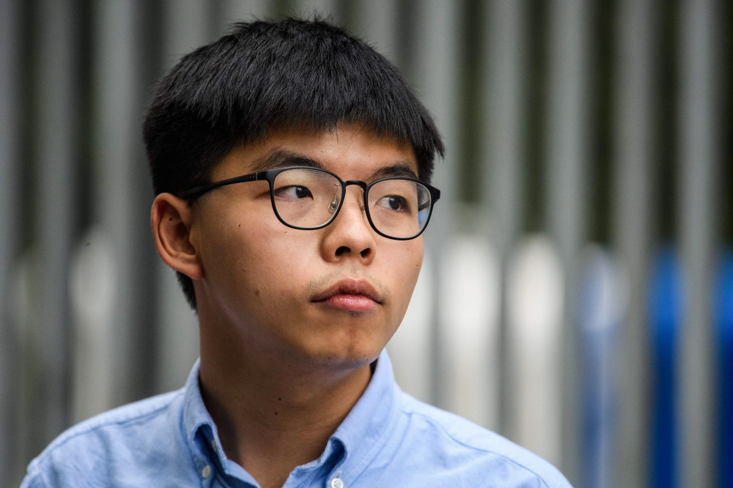 Pro-democracy activist Joshua Wong speaks to the media outside the Legislative Council (LegCo) in Hong Kong on October 29, 2019, after he was barred from standing in an upcoming local election.