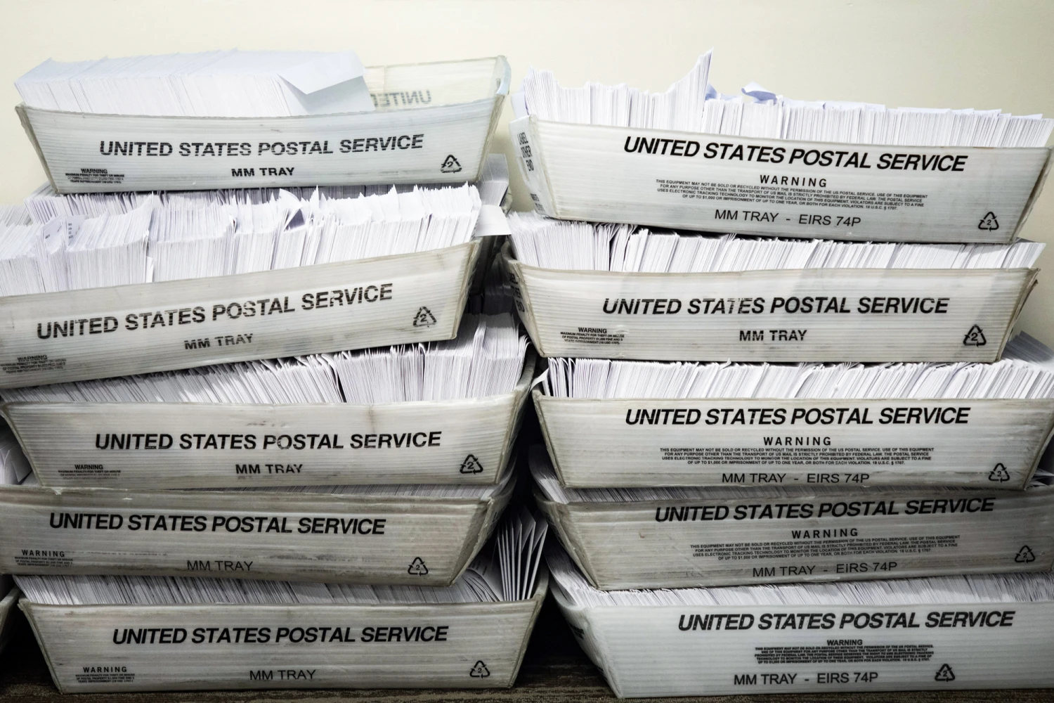 Large boxes of envelopes are seen as absentee ballot election workers stuff ballot applications at the Mecklenburg County Board of Elections office in Charlotte, N.C., on Sept. 4, 2020.