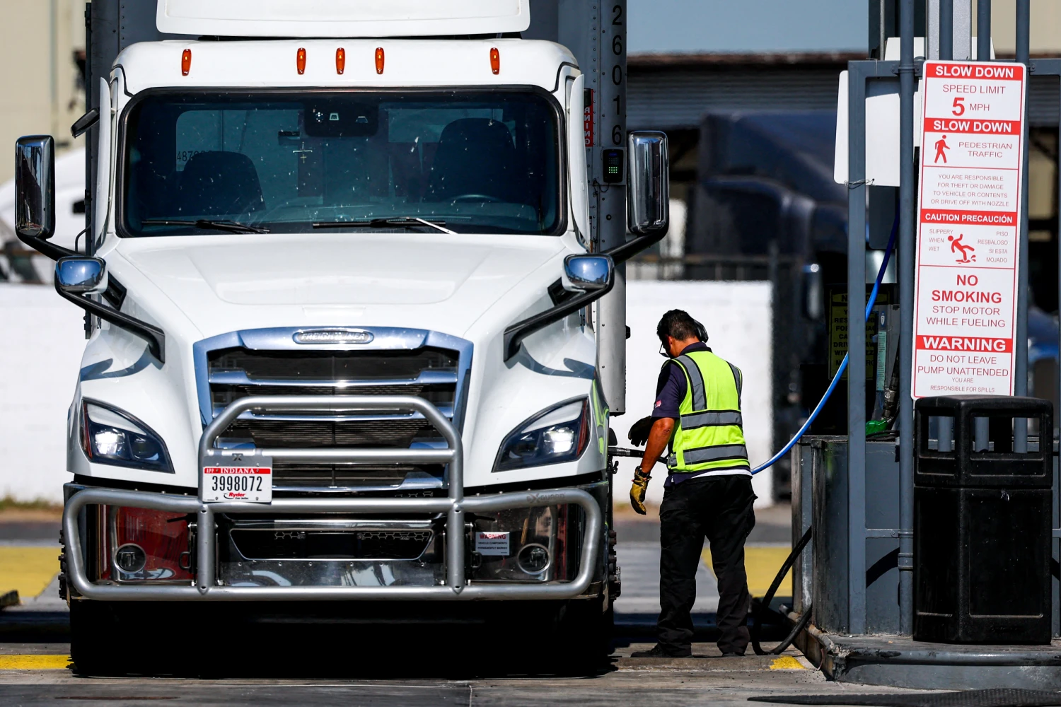 A truck driver refuels with diesel at a truck stop in Commerce, Calif., on Aug. 26, 2026.