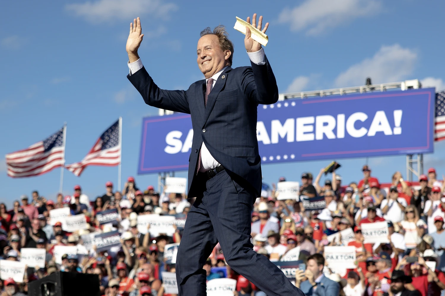 Texas Attorney General Ken Paxton waves to the crowd during a rally featuring former President Donald Trump on Saturday, Oct. 22, 2022, in Robstown, Texas.