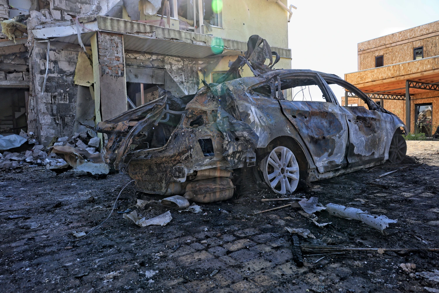 A burned-out car is seen outside a private house destroyed by a Russian attack in the Odesa region, Ukraine, on Sept. 4.