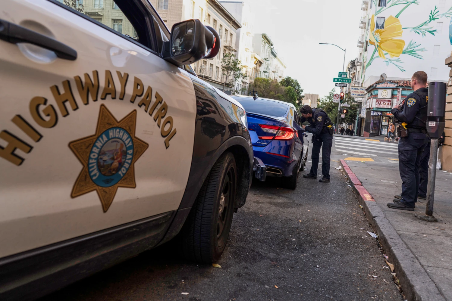 California Highway Patrol officers Rosales and Clark conduct a traffic stop in the Tenderloin neighborhood, where they have been deployed to assist in crime enforcement, on Thursday, Oct. 23, 2025, in San Francisco.