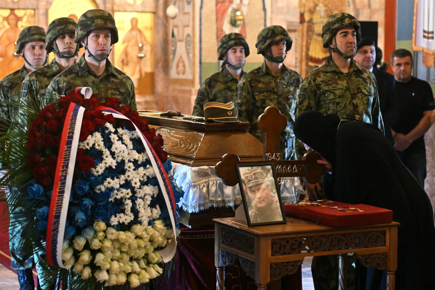 Serbian armed forces stand guard next to the coffin of late Bosnian Serb military leader Ratko Mladic during a public memorial on the day of his ceremony at St Lukas church in Belgrade, on September 7, 2026.