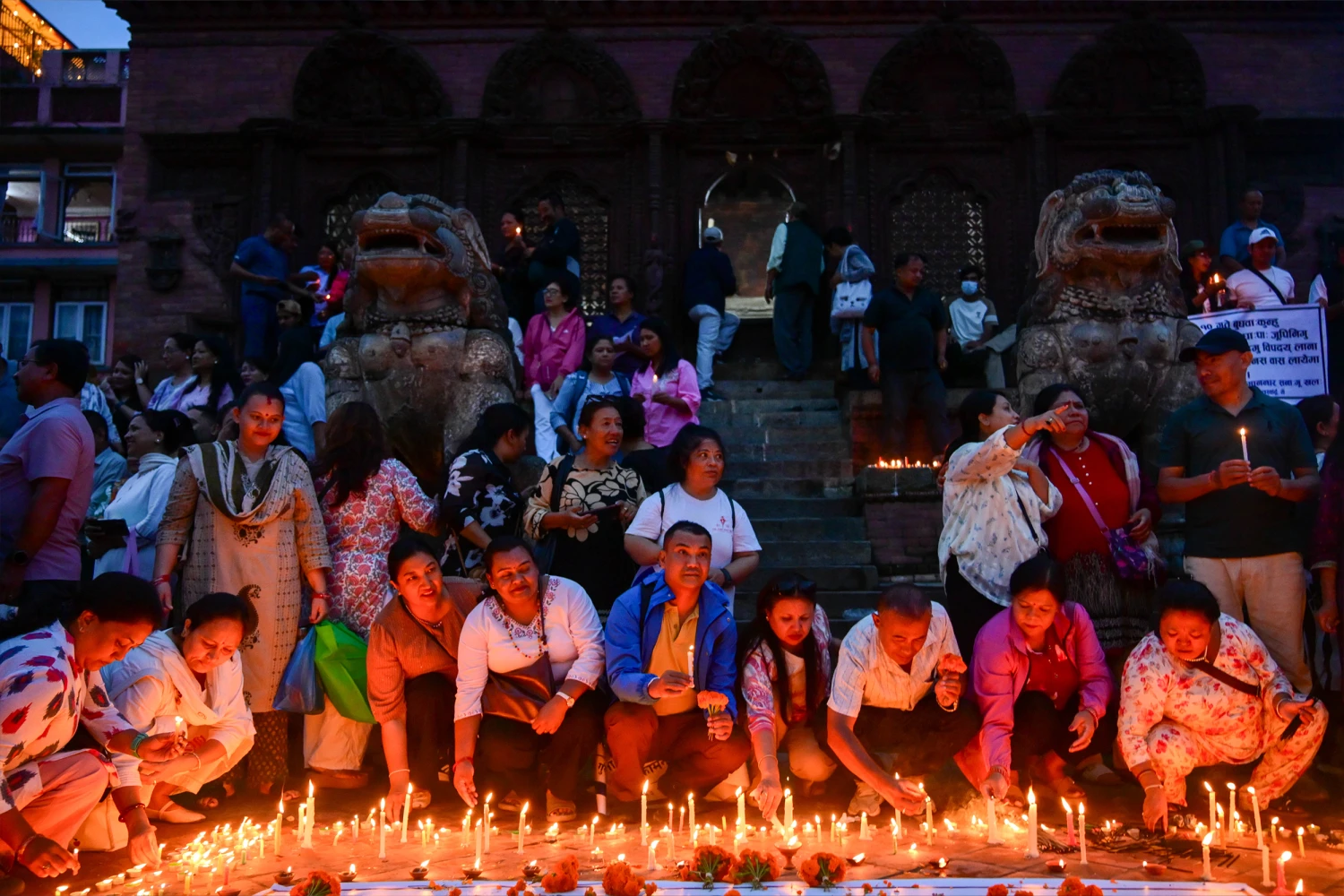 People light candles at Basantapur Durbar Square in Kathmandu, Nepal, on September 7, 2026, to honor those who lost their lives in the Bhote Koshi River floods and landslides in Rasuwa and other affected areas. (Photo by Safal Prakash Shrestha/NurPhoto via Getty Images)