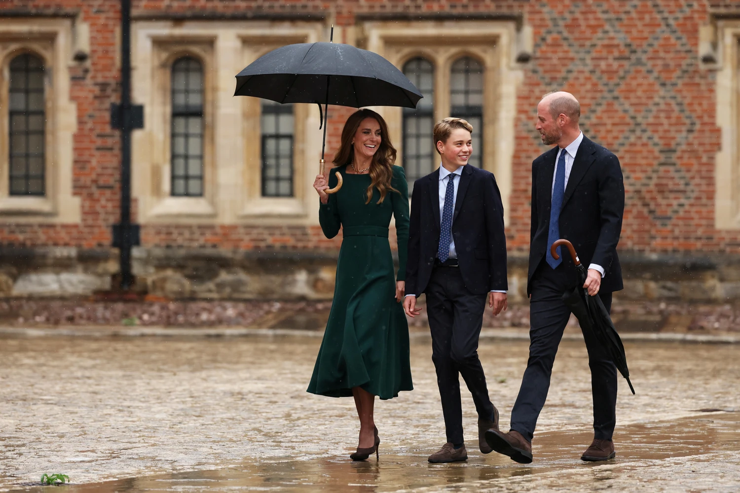 Catherine, Princess of Wales (L) and Prince William, Prince of Wales (R) walk with their 13-year-old son, Prince George of Wales (C), as he arrives for his first day at Eton College on September 8, 2026 in Berkshire, England.