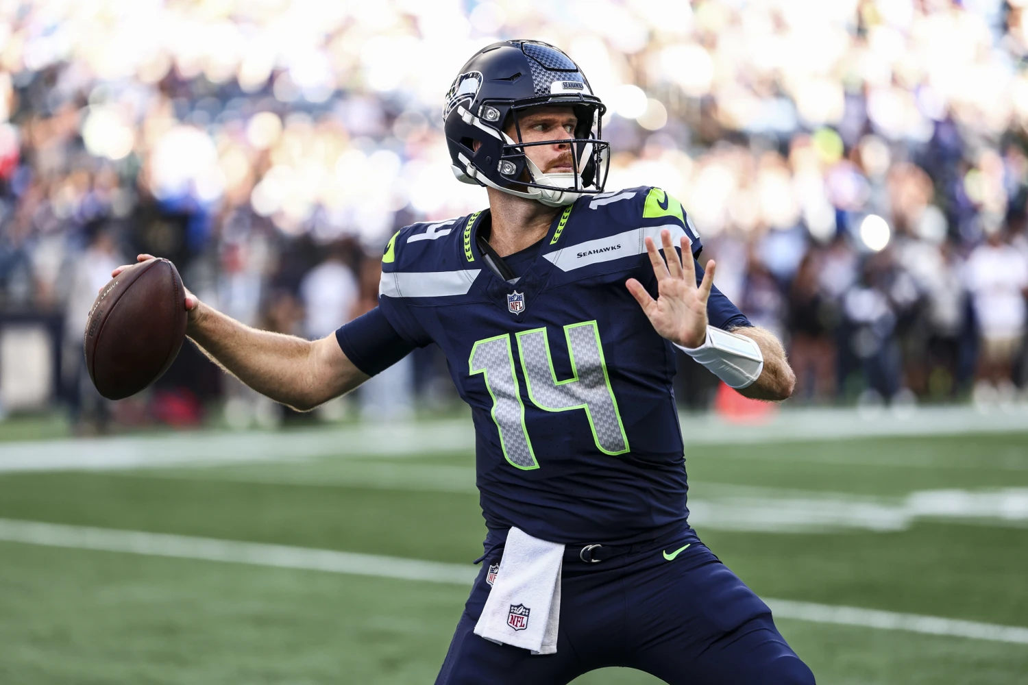 Sam Darnold #14 of the Seattle Seahawks warms up prior to the NFL football game against the New England Patriots at Lumen Field on September 9, 2026 in Seattle, Wash.