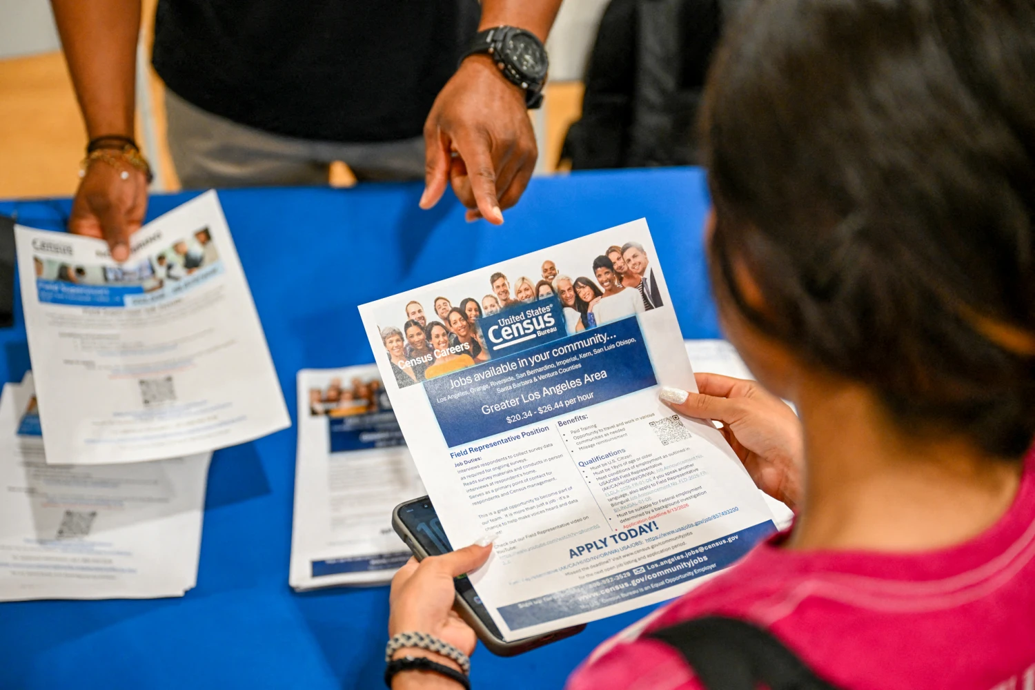 A job seeker looks at a U.S. Census Bureau now hiring flyer about jobs in Los Angeles on July 29, 2026.