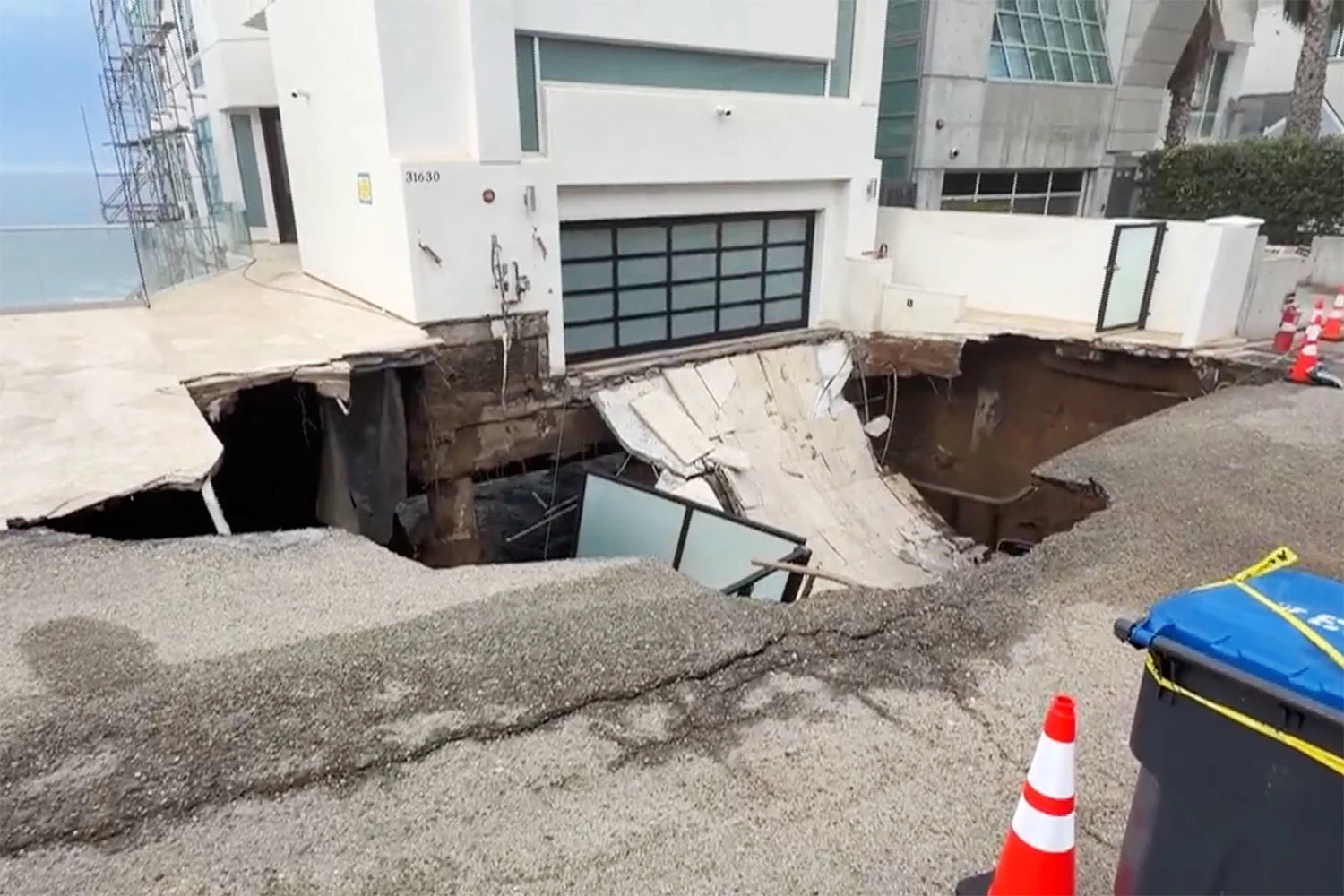 A collapsed driveway outside a beachfront home in Malibu, Calif., on Sept. 8, 2026.
