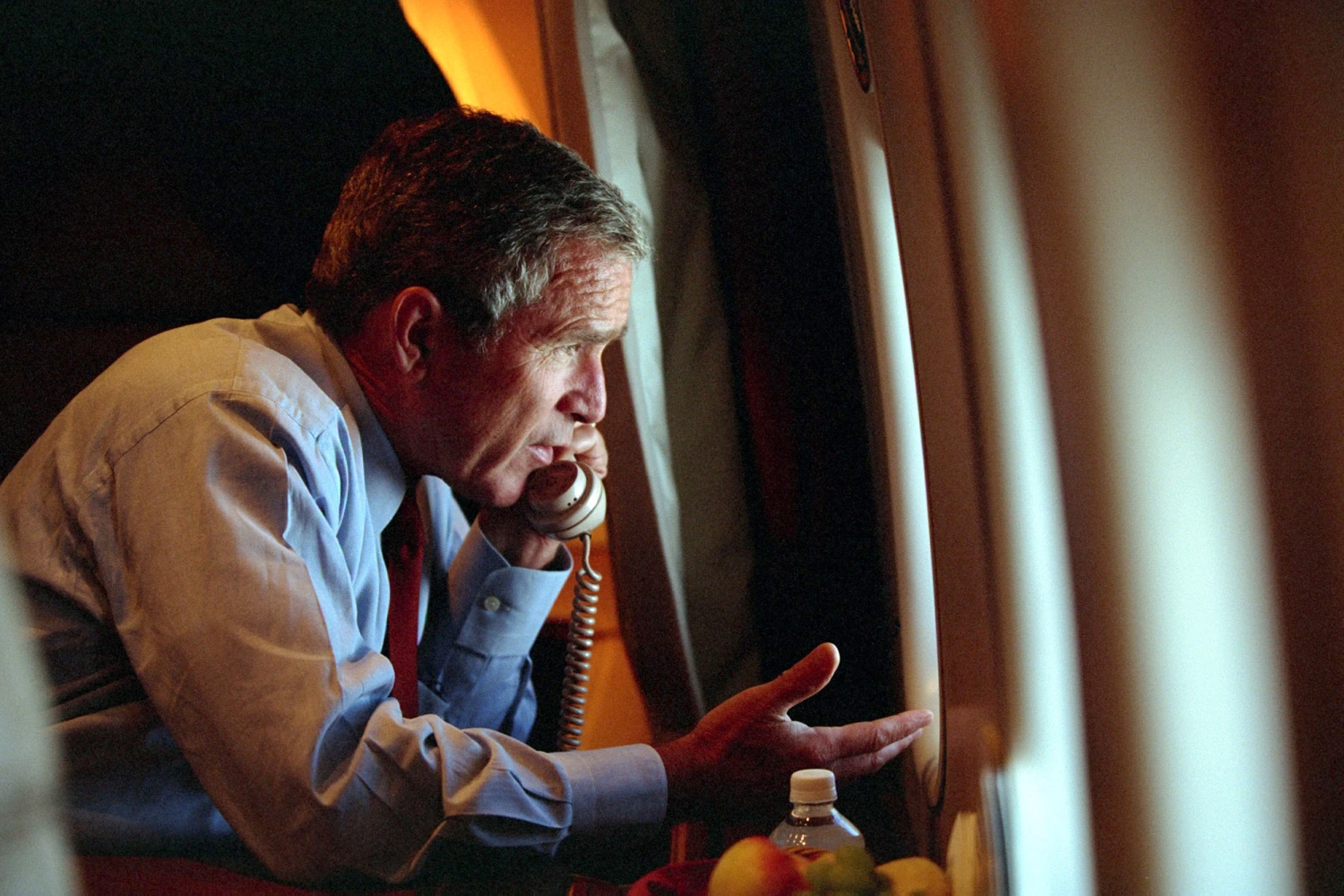 George W. Bush speaks to Vice President Dick Cheney by phone aboard Air Force One September 11, 2001 after departing Offutt Air Force Base in Nebraska.