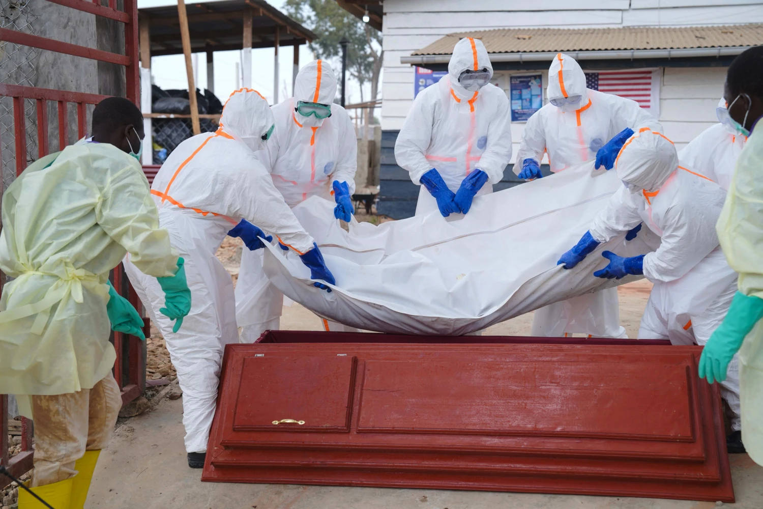 Health workers who are members of the safe and dignified burial team prepare to bury Abineno Justine, a 38 year old woman who died of the Ebola virus, in Bunia, Congo, Friday, Sept. 4, 2026.