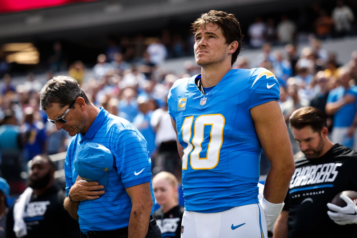 Los Angeles Chargers head coach Jim Harbaugh, left, and quarterback Justin Herbert (10) before an NFL football game against the Arizona Cardinals on Sept. 13, 2026, in Inglewood, Calif.