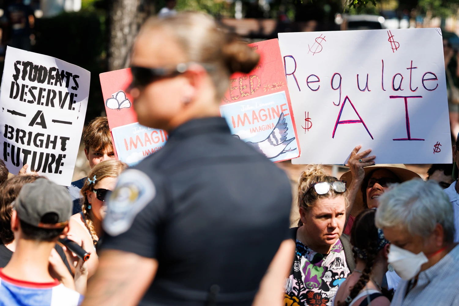 Demonstrators against artificial intelligence (AI) hold signs during a protest outside the G20 Innovation Ministerial in Chapel Hill, North Carolina, US, on Wednesday, Sept. 2, 2026.