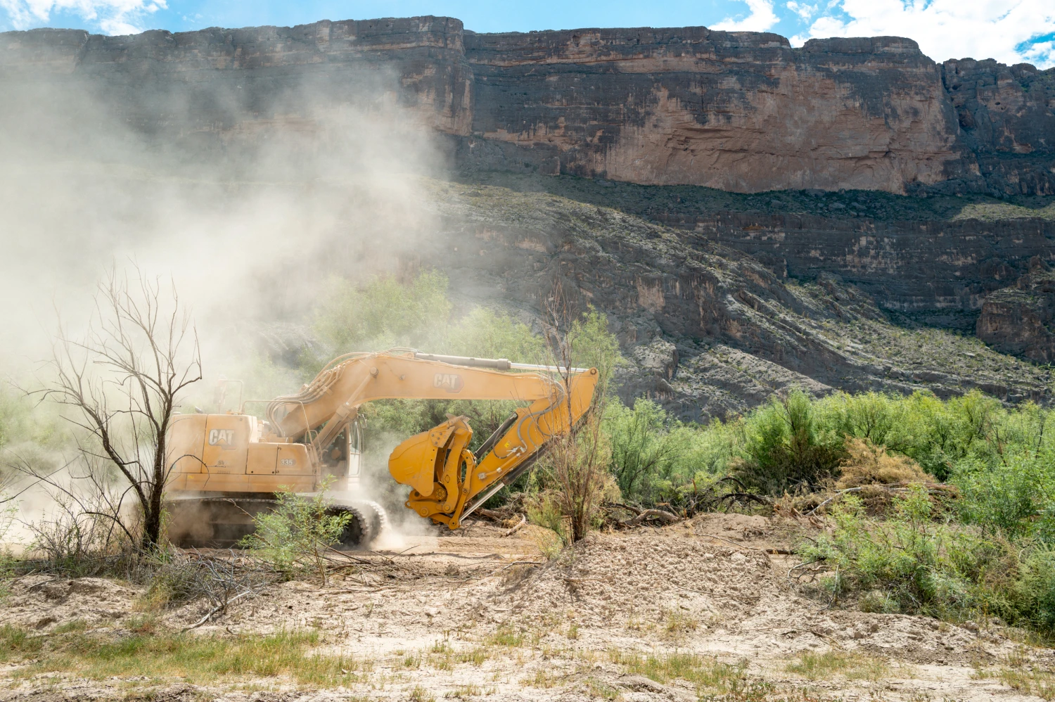 An excavator during construction for a section of border wall near Santa Elena Canyon on Aug. 14 in Big Bend National Park.