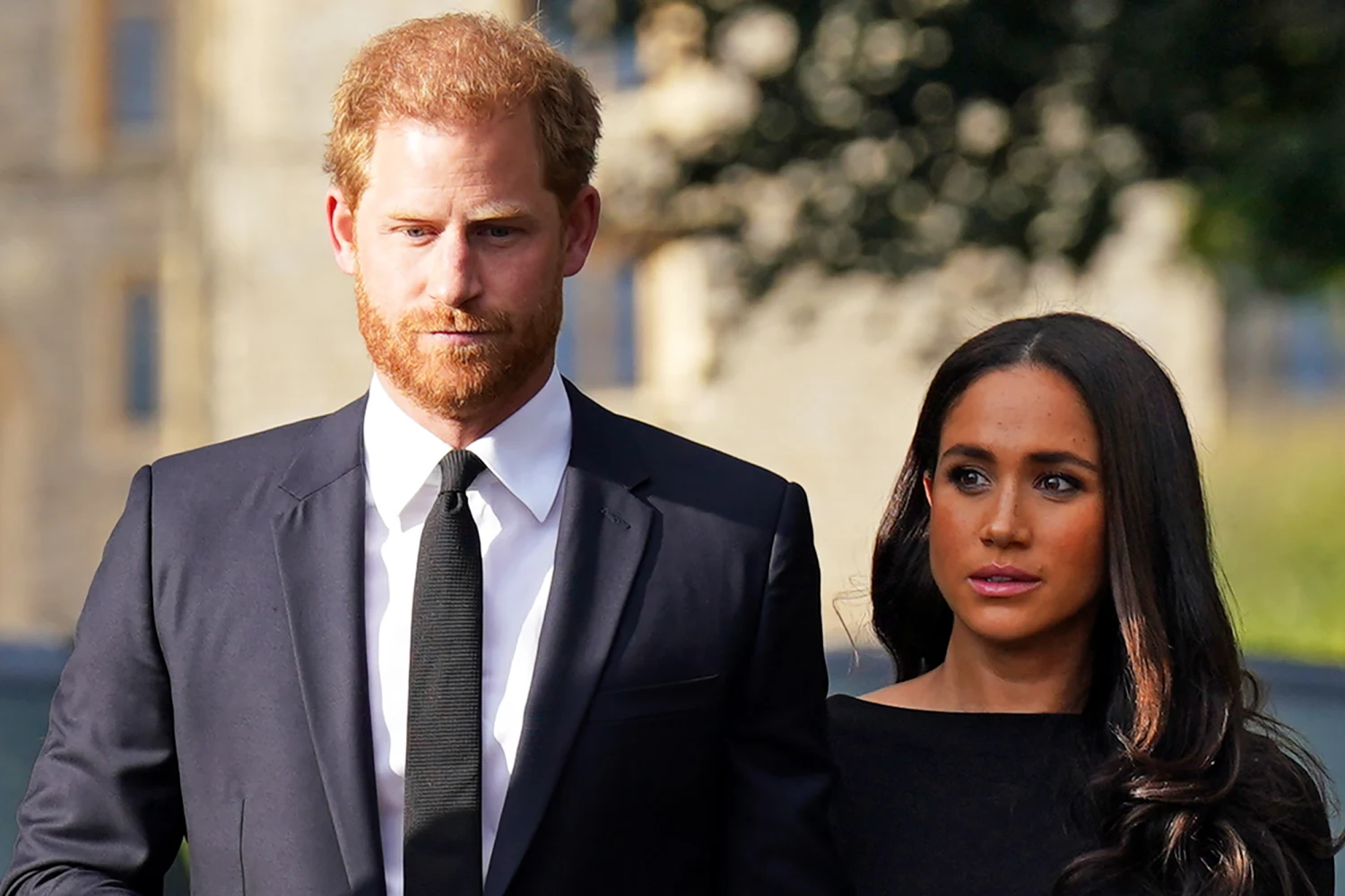Prince Harry, Duke of Sussex, and Meghan, Duchess of Sussex walk together to meet members of the public on the long Walk at Windsor Castle on September 10, 2022 in Windsor, England.