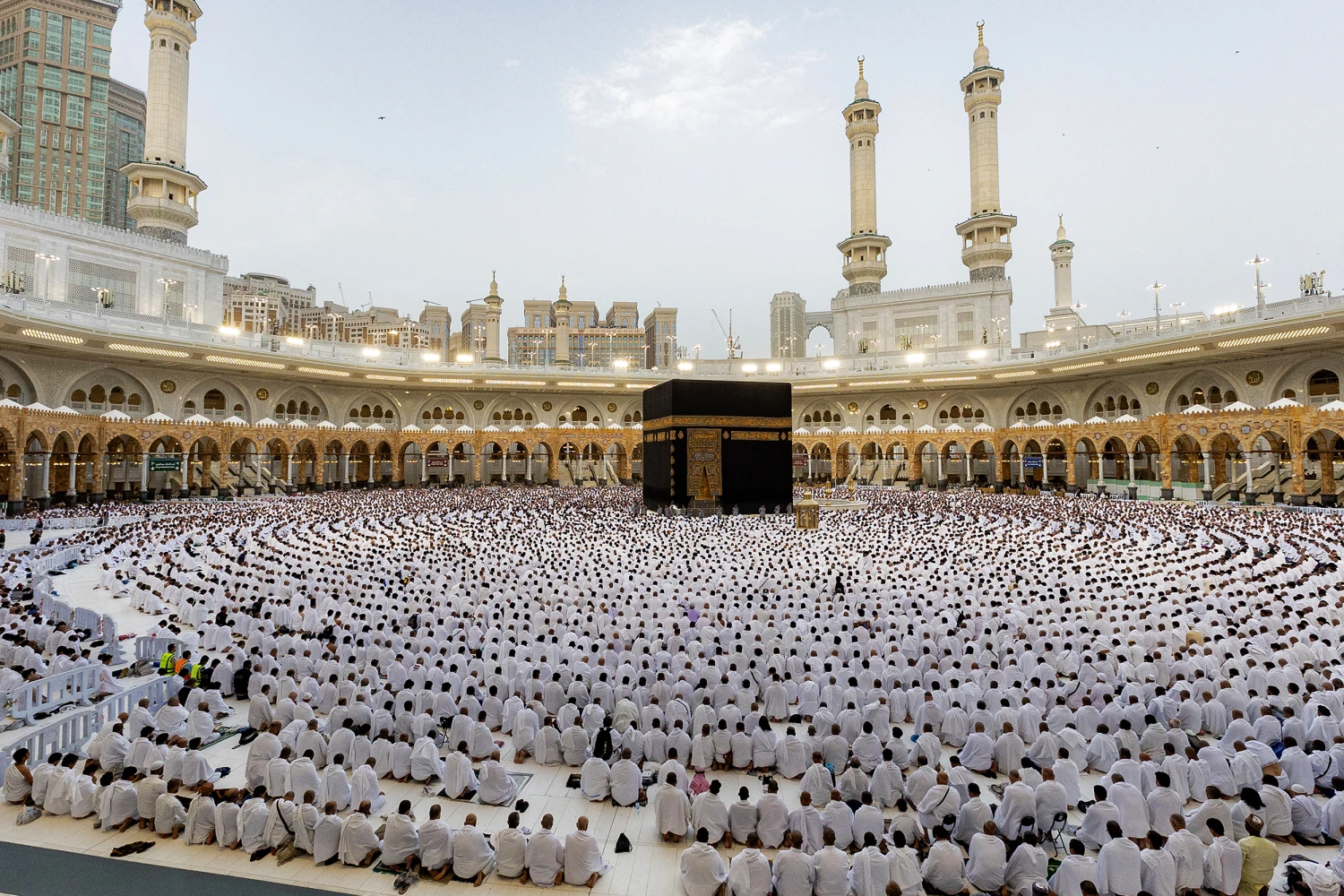 Muslim worshippers gather around the Kaaba, Islam's holiest shrine, at the Grand Mosque complex in Saudi Arabia's holy city of Mecca on March 20, 2026 for the early morning prayers for Eid al-Fitr, marking the end of the holy month of Ramadan.