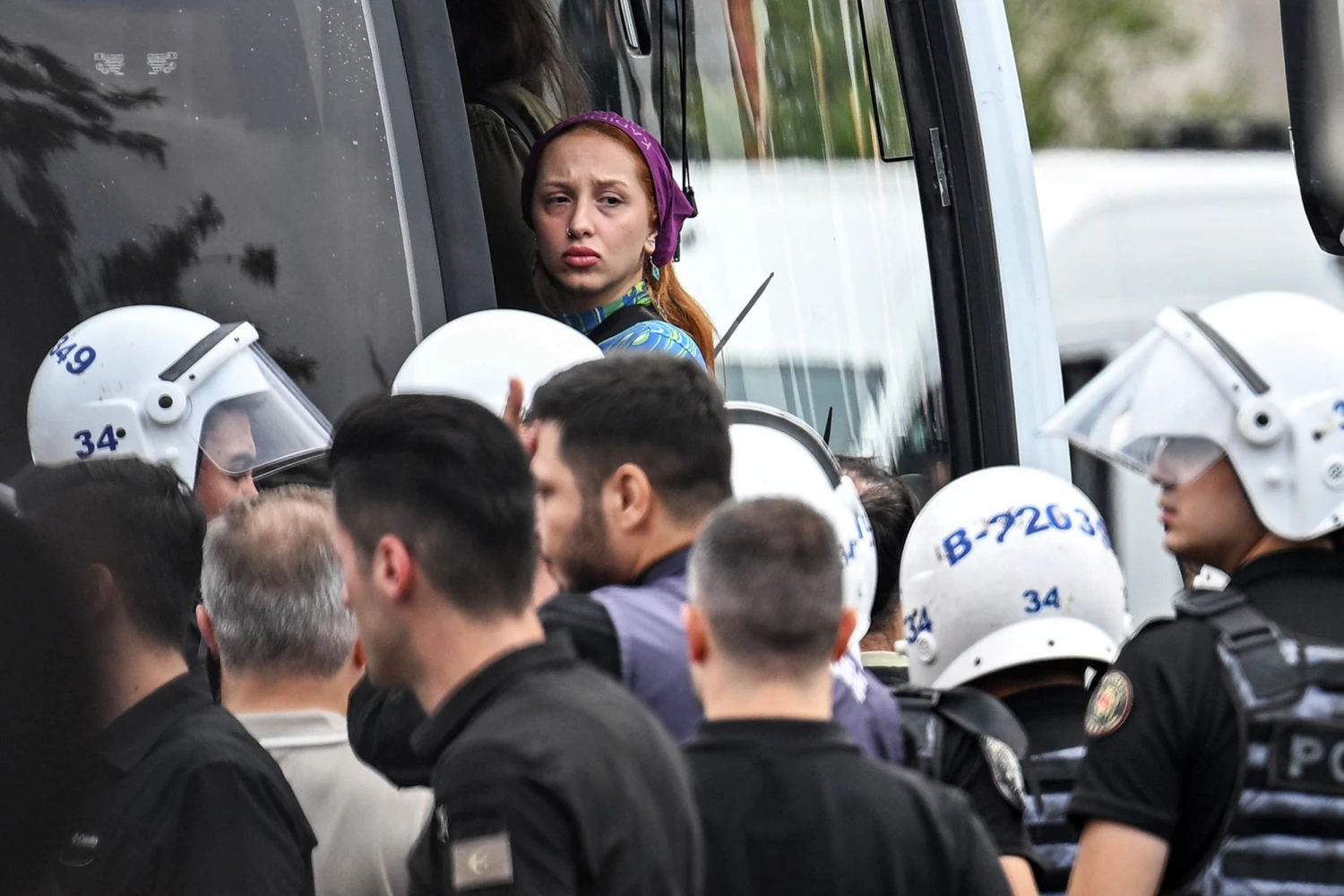 Turkish police escort arrested protesters into a bus during a demonstration outside Istanbul's courthouse to protest over the arrest and growing targeting of LGBTQ activists, in Istanbul on September 15, 2026.
