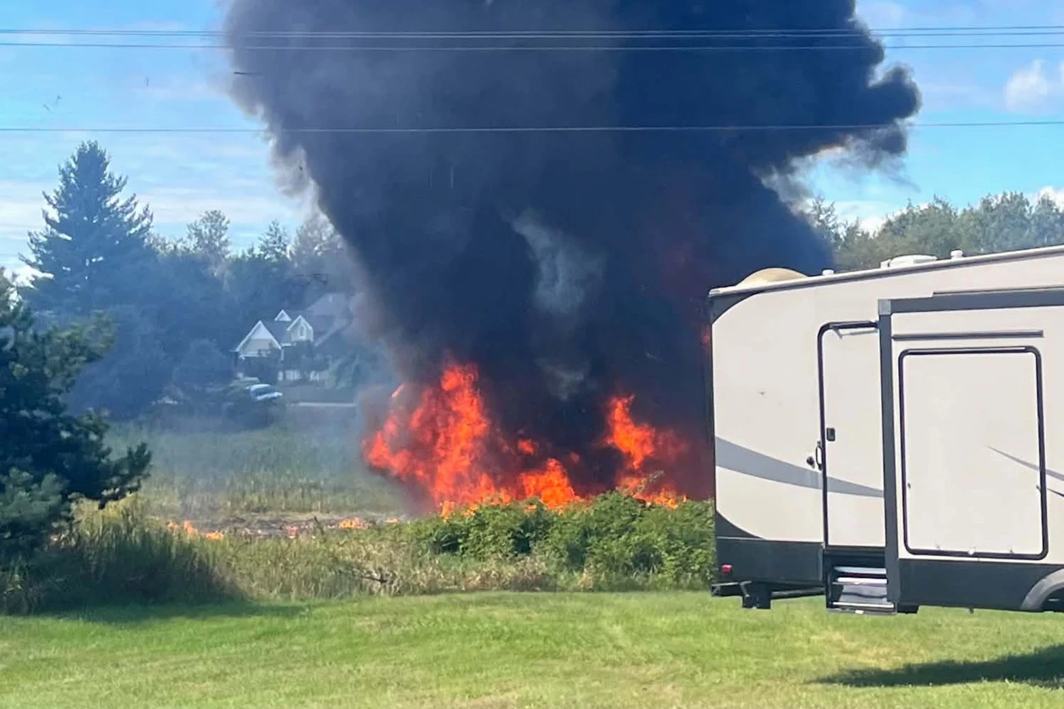 Smoke rises after an F-16 fighter jet crashed in a rural area near Traverse City, Mich., Thursday, Sept. 17, 2026.
