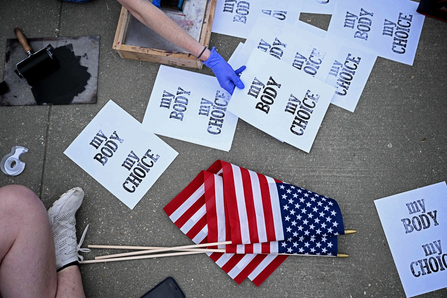 Pro-choice demonstrators make signs in front of the US Supreme Court in Washington, DC, on May 3, 2022.
