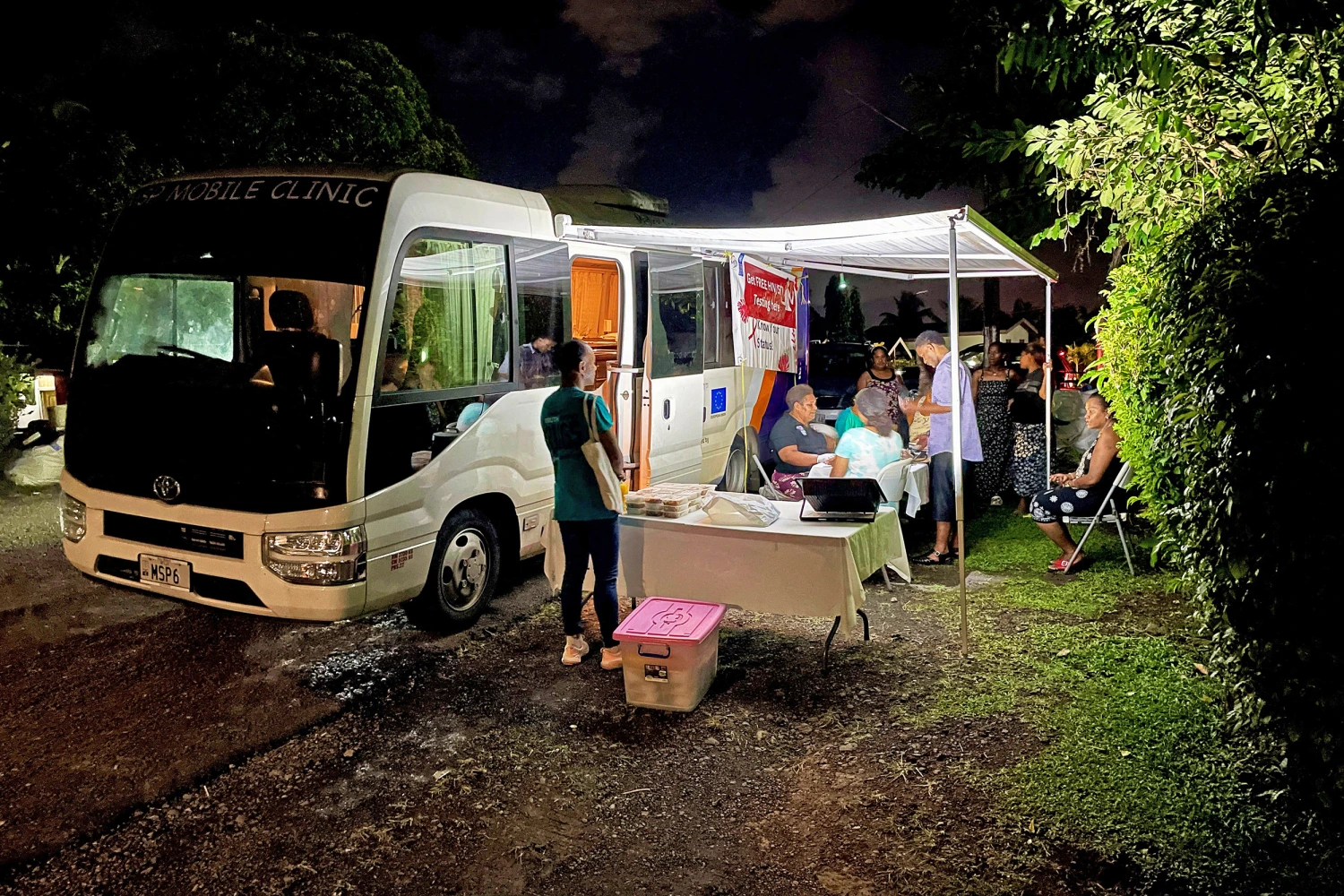 This picture taken on March 19, 2026 shows a Medical Services Pacific Moonlight programme team offering free HIV testing during an outreach visit to a suburb of Suva.