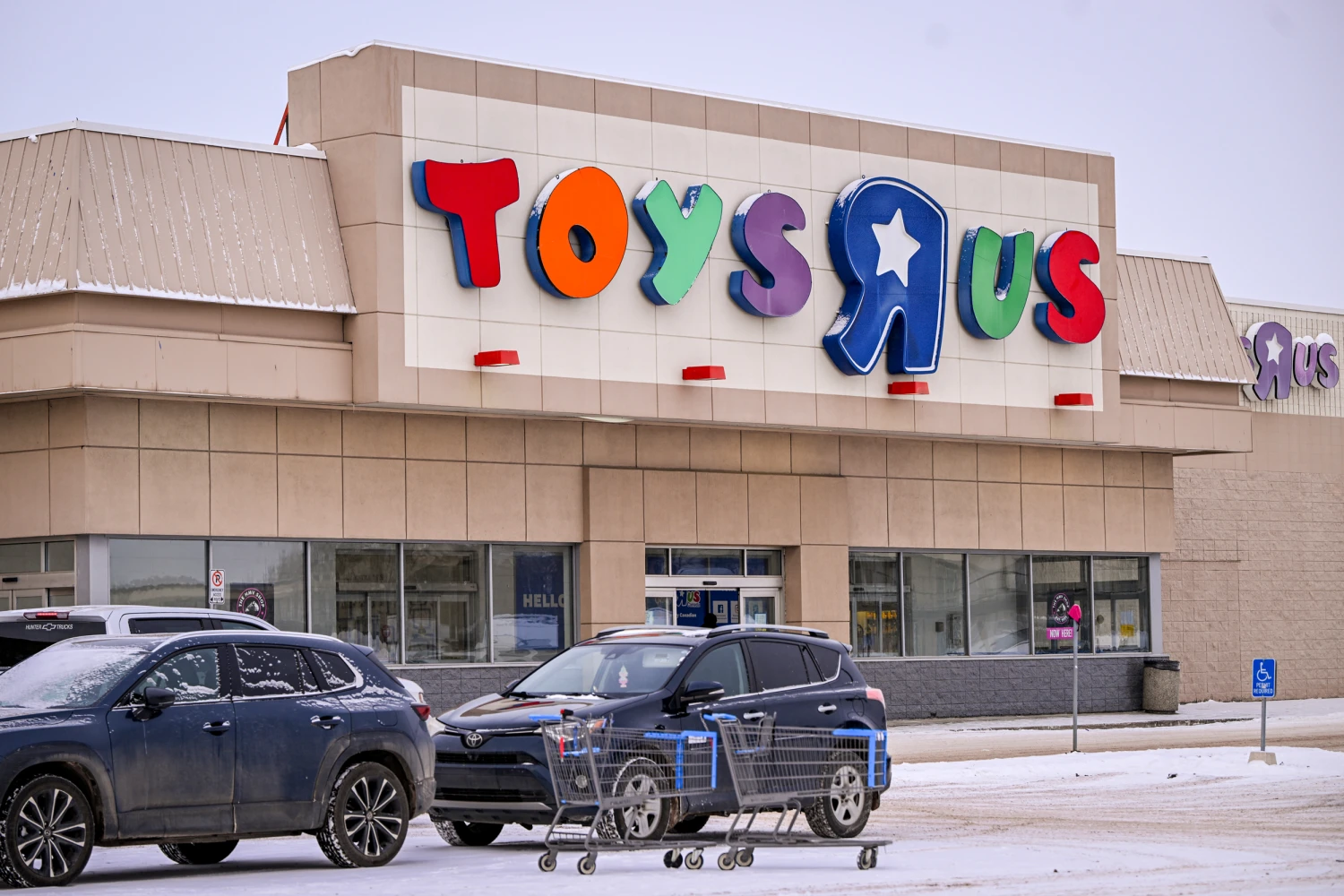 The Toys 'R' Us logo is displayed on the storefront in Edmonton, Canada, on Feb. 15, 2025.