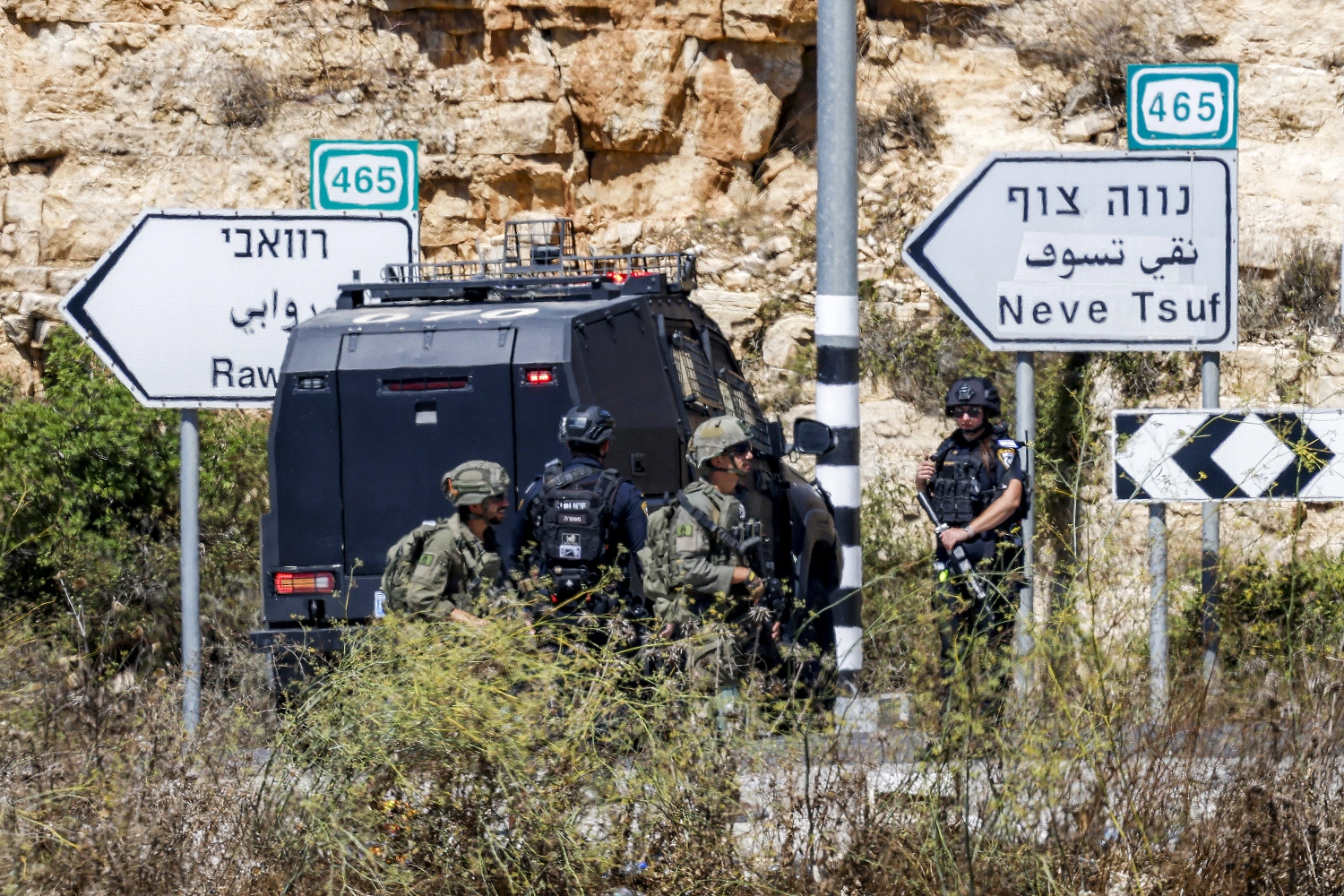 Israeli soldiers and police close the Atara checkpoint, north of Ramallah in the Israeli-occupied West Bank, and block the road leading to the Israeli settlement of Halamish on September 20 following a reported attack by a Palestinian.