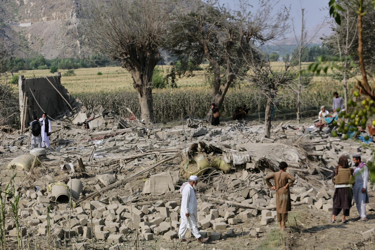 Residents inspect the rubble of a house destroyed in a strike in Patan village, Kunar province, eastern Afghanistan, Monday, Sept. 21, 2026.