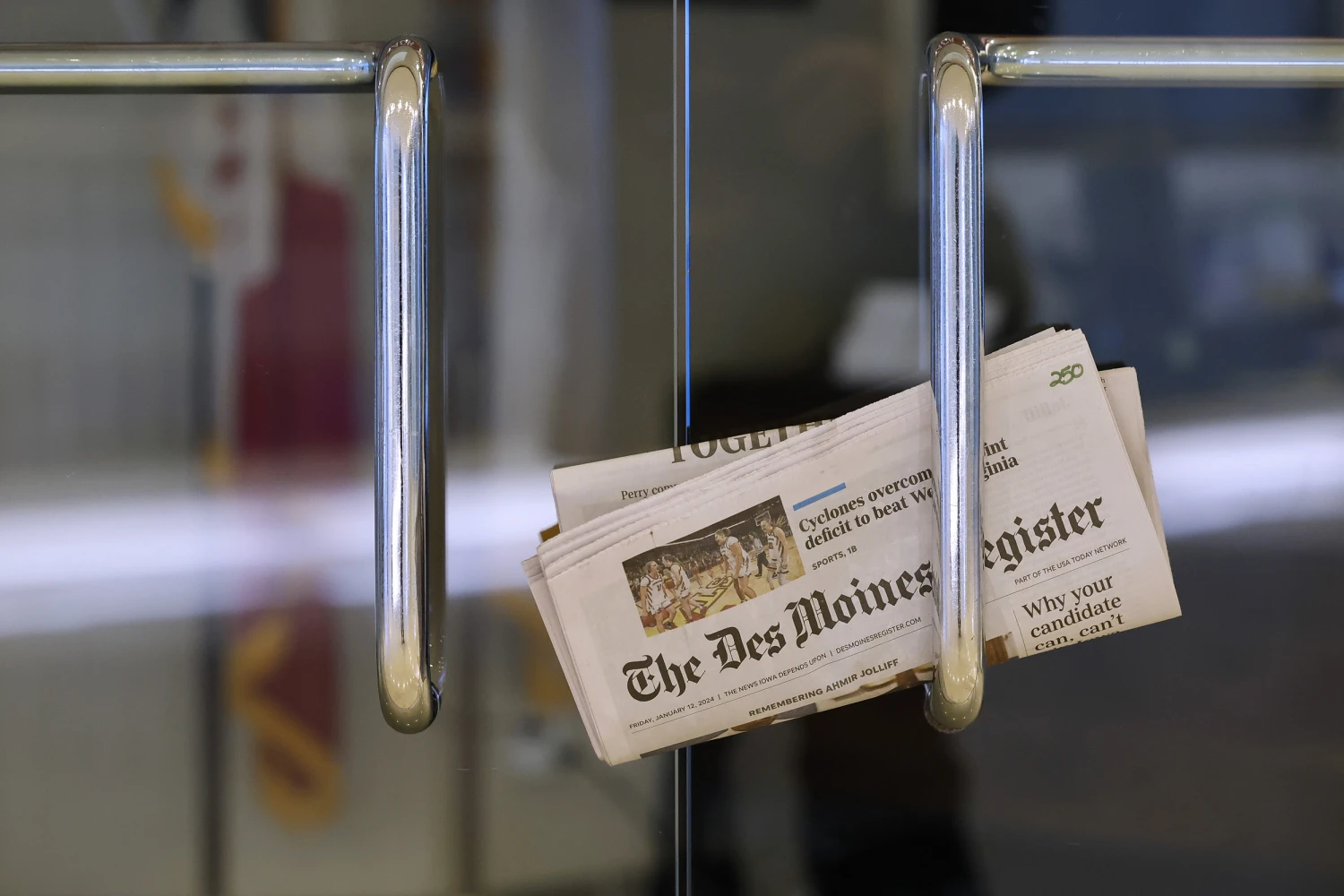 A copy of The Des Moines Register is tucked into an office door as Winter storm Gerri arrives in Iowa four days before the caucuses on January 12, 2024 in Des Moines, Iowa.
