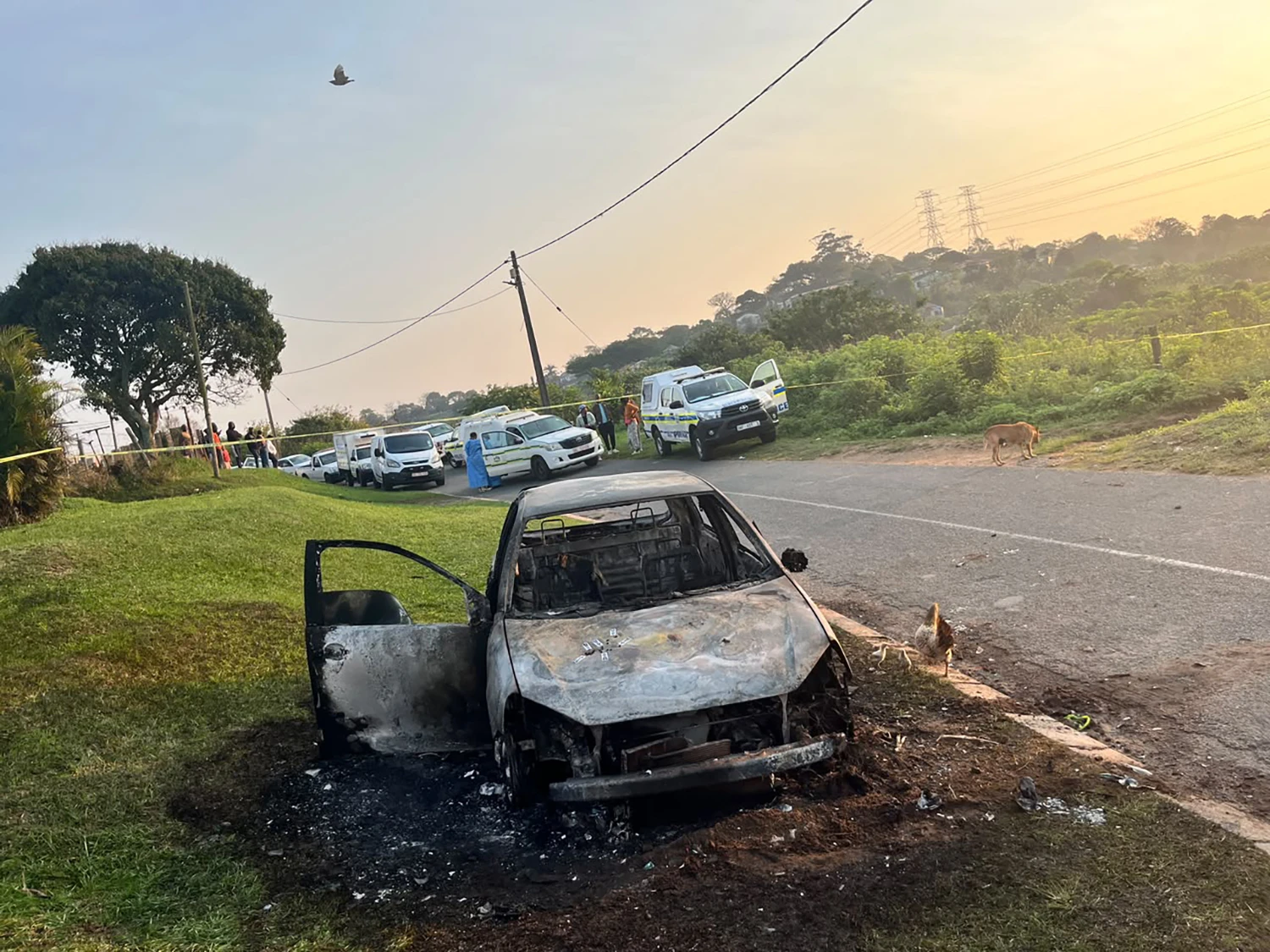 A burned out vehicle at the scene of a mass shooting in a suburb of Durban, South Africa on Sept. 23, 2026 which left 11 dead.
