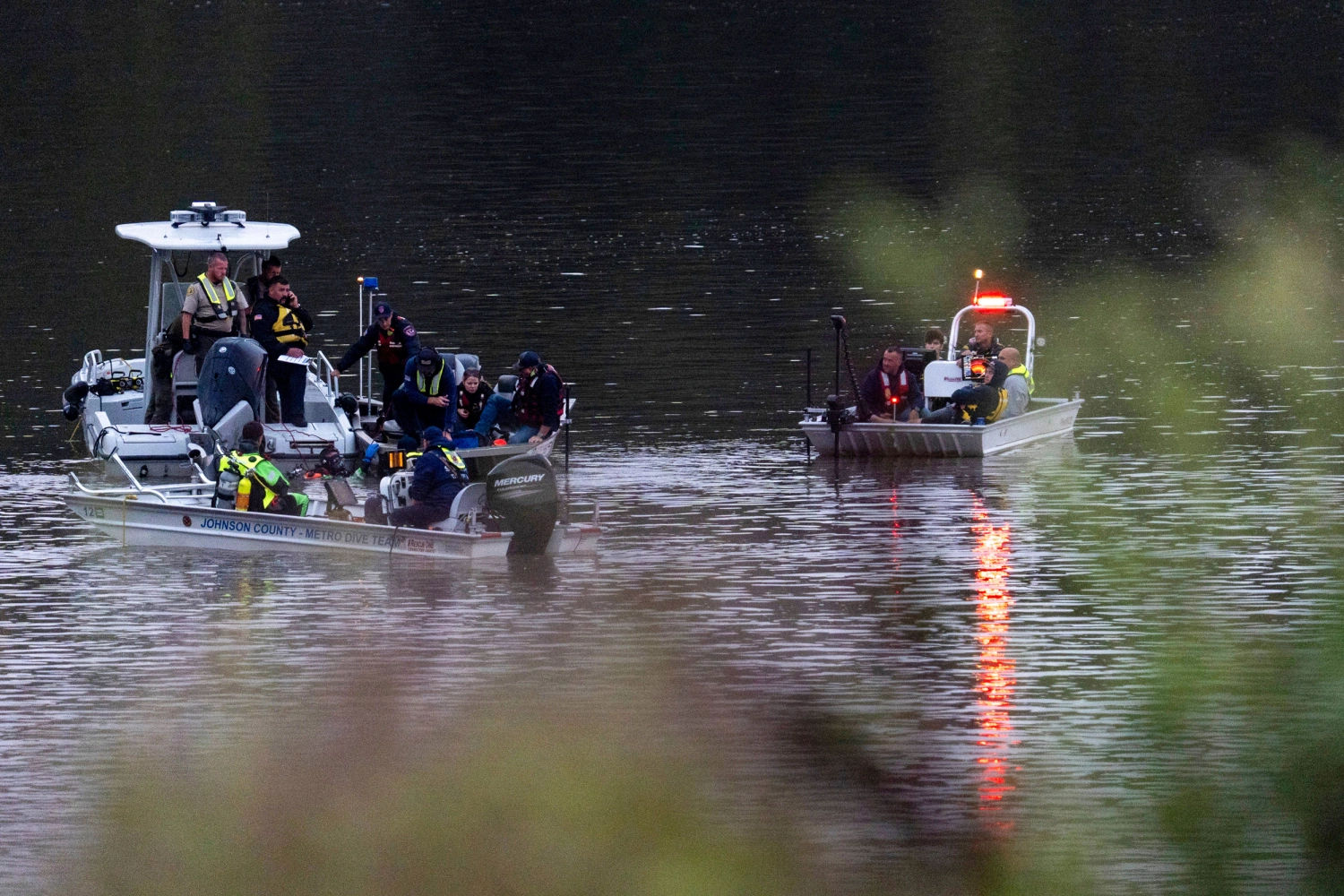 Emergency response personnel search a portion of the Iowa River near Lake Macbride on Sept. 22, 2026, near Solon, Iowa.