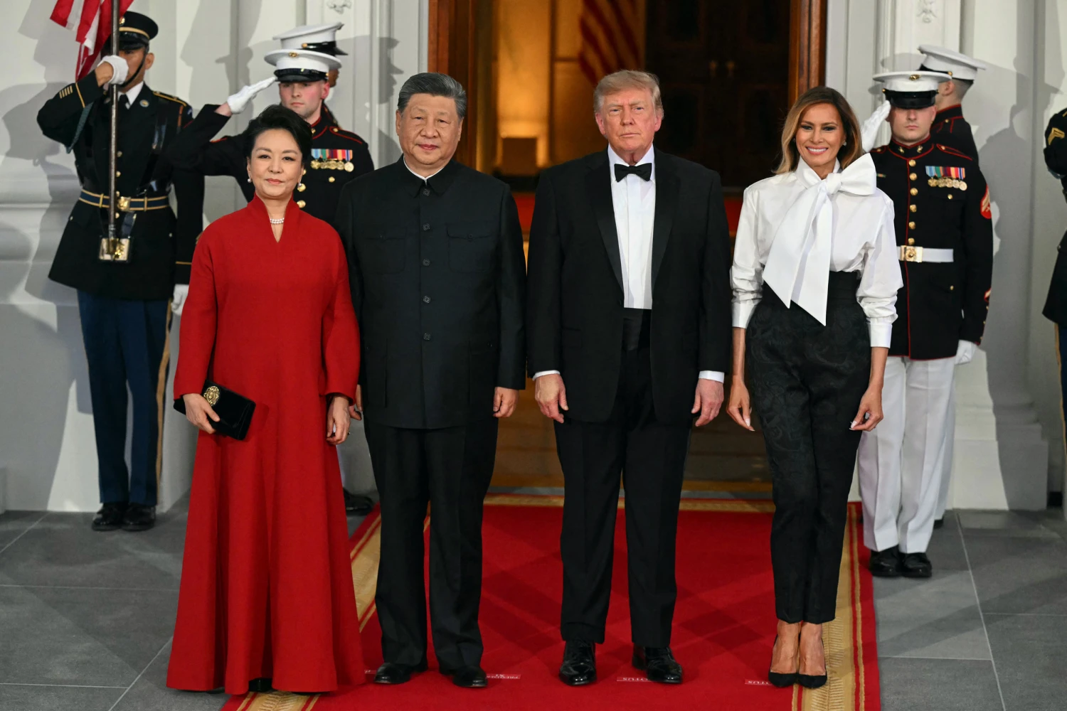 China's First Lady Peng Liyuan, left, China's leader Xi Jinping, U.S. President Donald Trump and U.S. First Lady Melania Trump pose on the North Portico steps of the White House ahead of a State Dinner in Washington, DC, on September 24, 2026.
