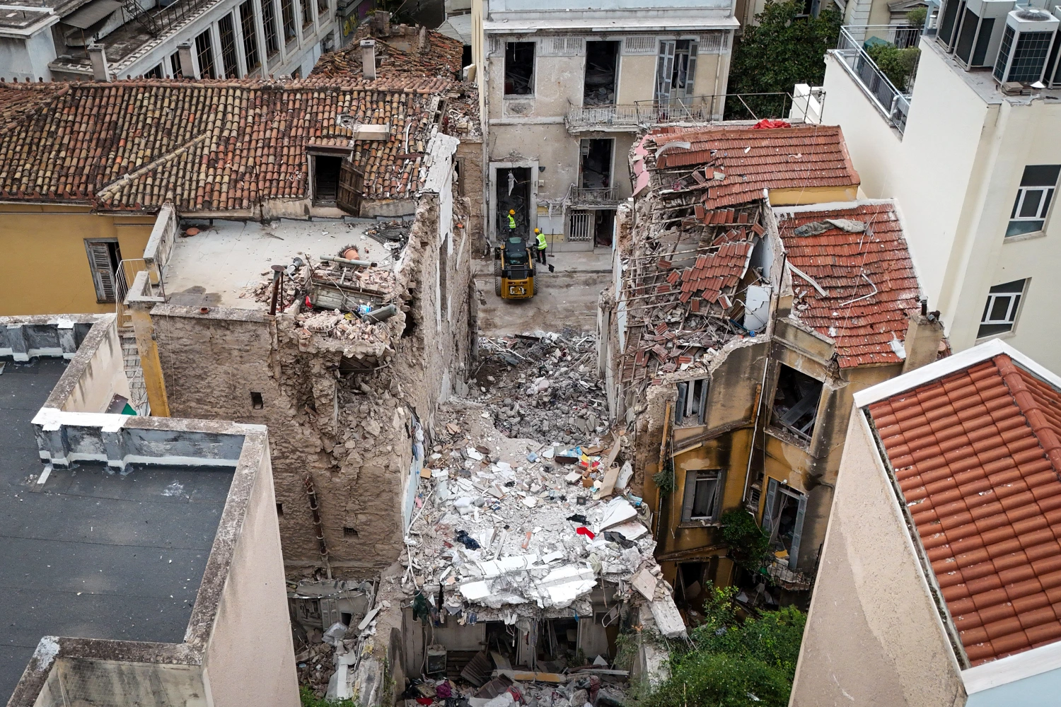 Excavators remove debris following a blast in the Plaka district of Athens, Greece, on Sept. 26, 2026.