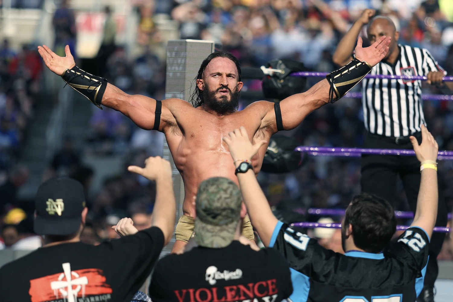 Adrian Neville celebrates with fans during WrestleMania 33 on Sunday, April 2, 2017 at Camping World Stadium in Orlando, Fla.