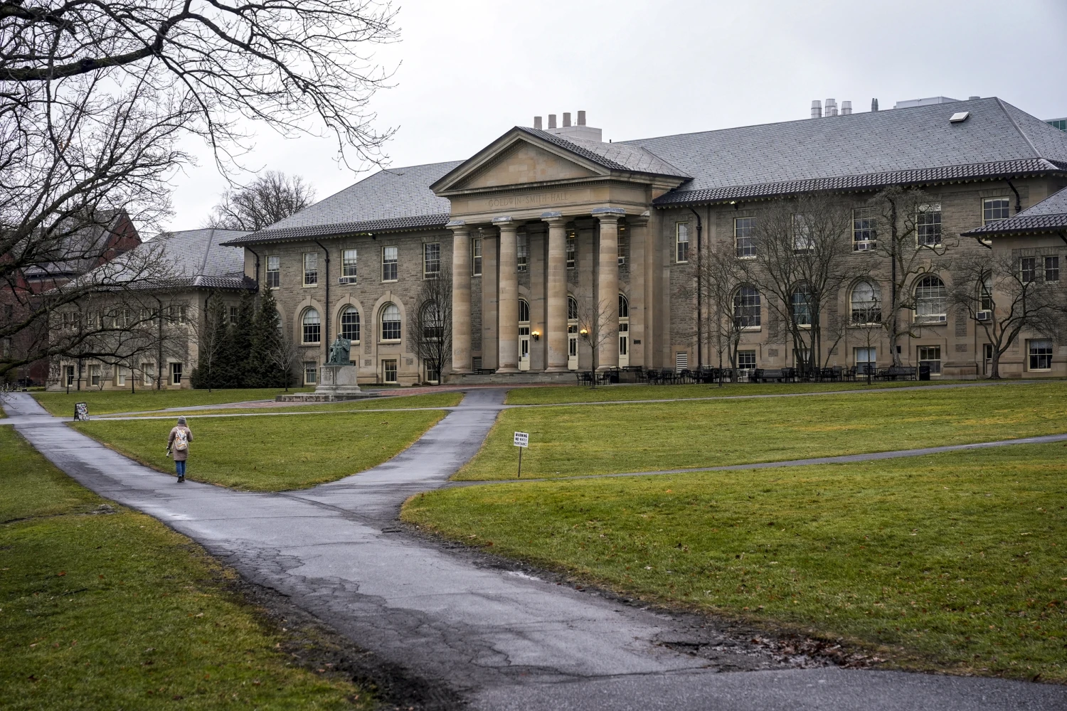 People walk on the campus of Cornell University in Ithaca, N.Y., on Feb. 2, 2024.