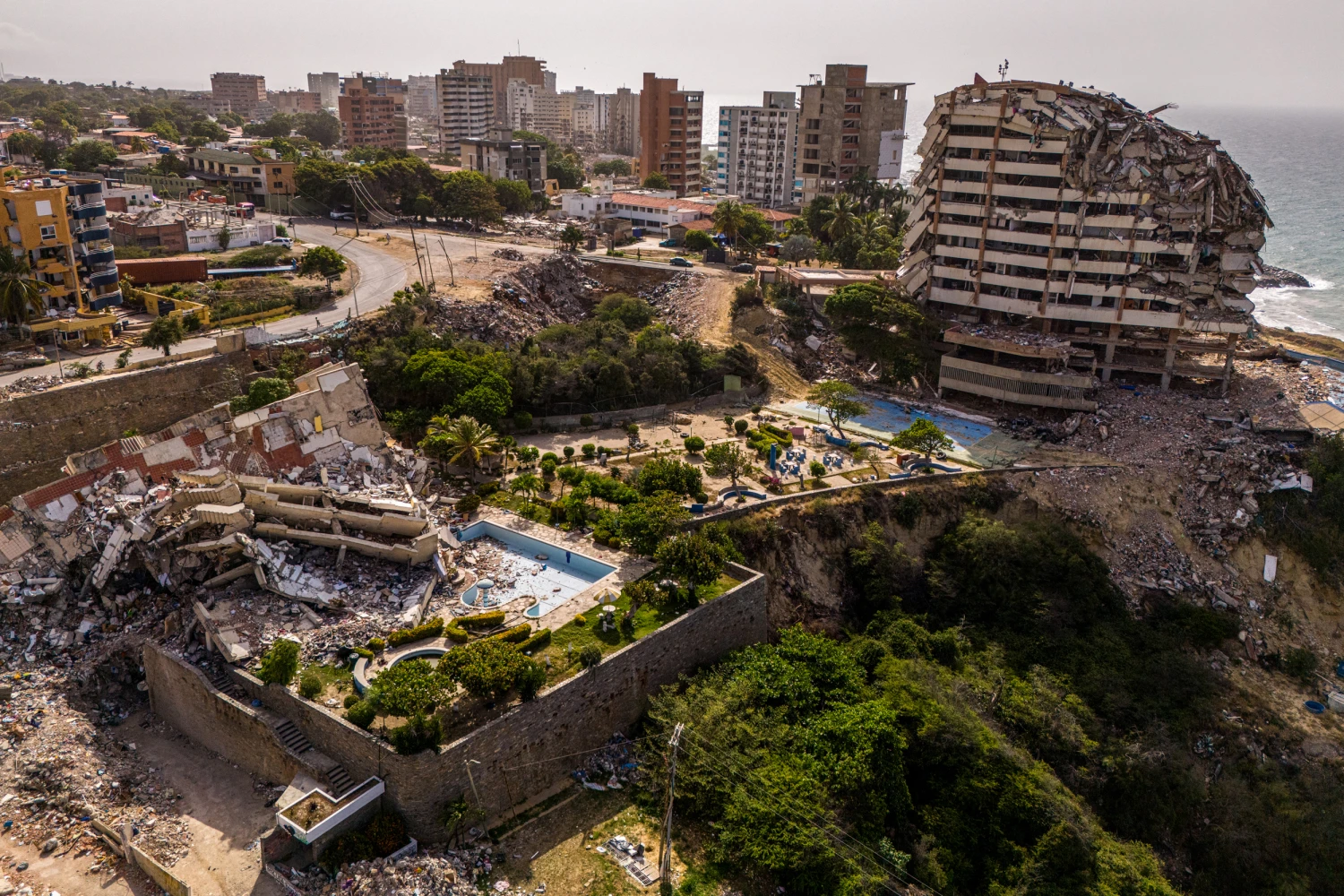This aerial view shows an area affected by the collapse of structures after the earthquake of June 24, iin Catia La Mar, Venezuela, on August 4, 2026. (Photo by Maxwell BRICENO / AFP via Getty Images)