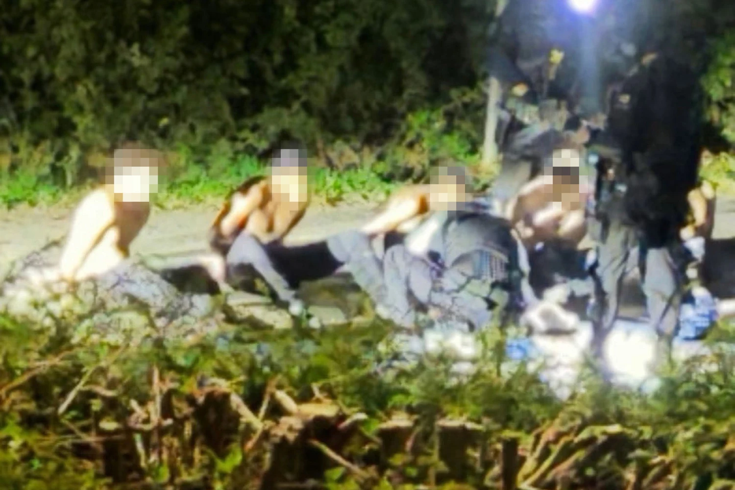 An image circulating on social media shows handcuffed suspects near RAF Fairford air base on Sunday.