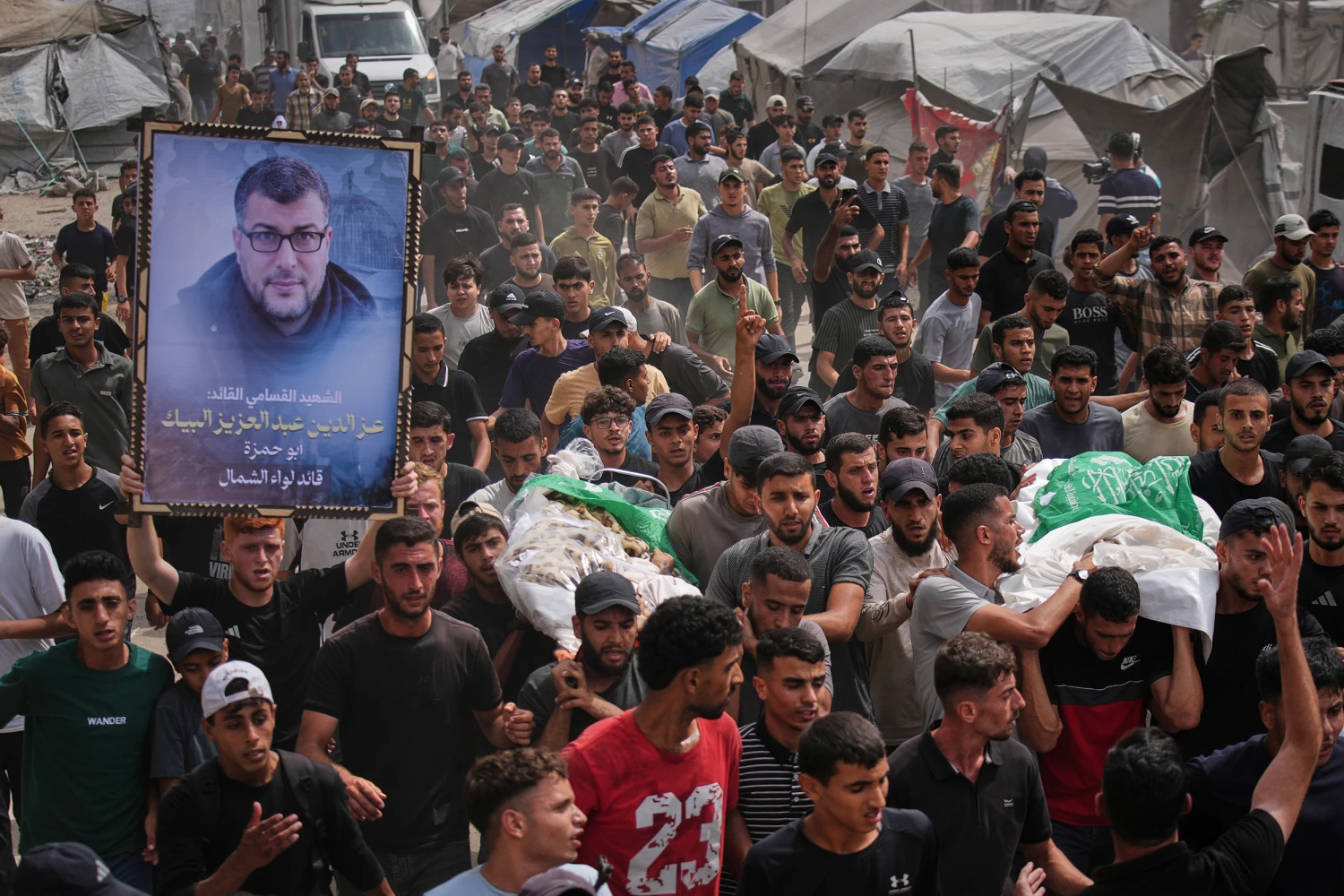 Palestinians carry the bodies of Hamas militants Mohannad Abu Foul and Izz Al Din Al Beik, draped in the group's flag, during their funeral after they were killed in an Israeli airstrike, in Gaza City, Tuesday, Sept. 29, 2026.