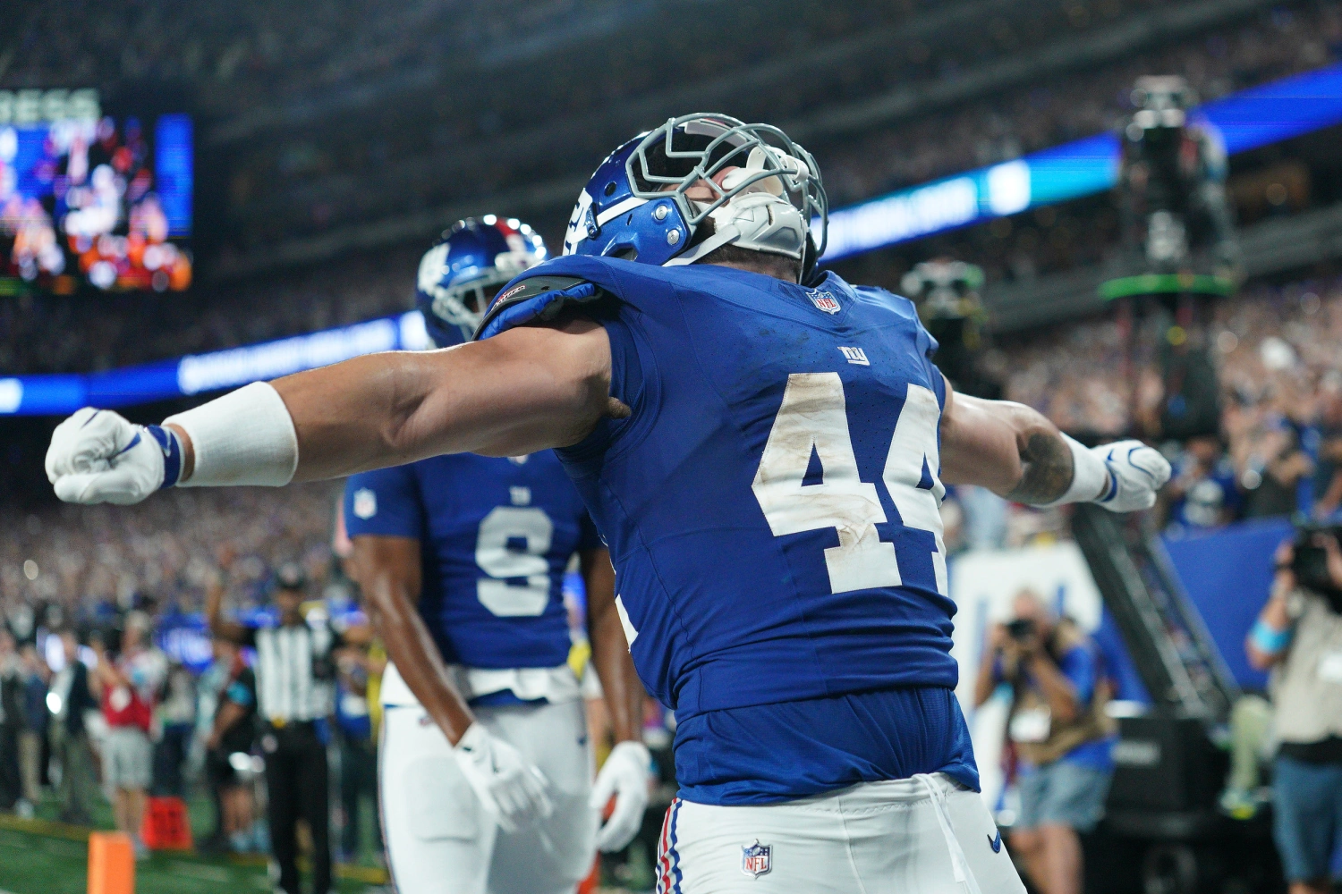 Giants running back Cam Skattebo celebrates a touchdown during the first quarter against the Dallas Cowboys at MetLife Stadium.