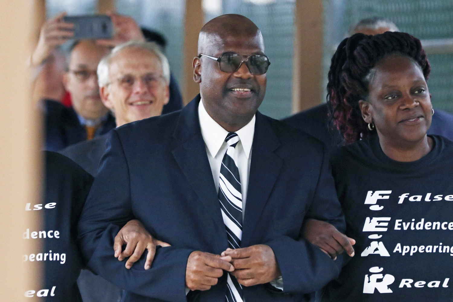 Curtis Flowers flanked by sister Priscilla Ward, from right, exits the Winston Choctaw Regional Correctional Facility in Louisville, Miss., on Dec. 16, 2019.