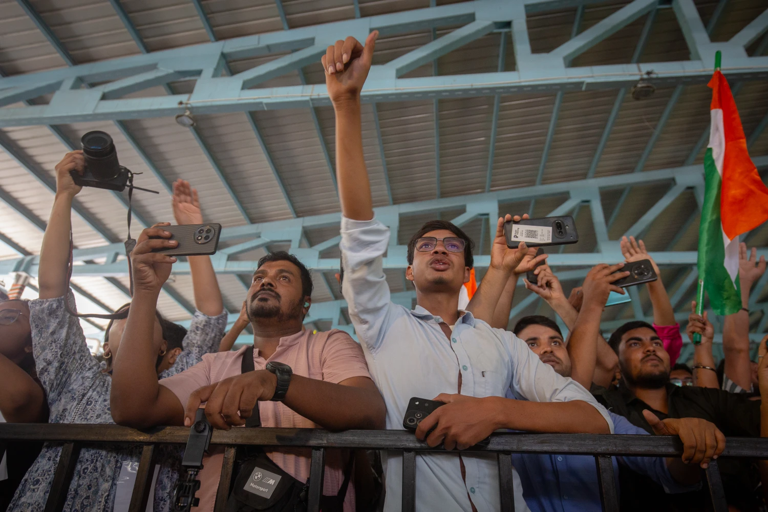 BENGALURU, INDIA - OCTOBER 08: People wave placards and shout slogans as they participate in a protest demanding the resignation of India's chief election commissioner Gyanesh Kumar over alleged voter-roll irregularities on October 08, 2026 in Bengaluru, India. Opposition parties, student groups and India’s youth ‘Cockroach’ movement have intensified protests against the Election Commission’s nationwide Special Intensive Revision of voter lists, which has removed over 130 million people, though the government and poll panel deny allegations of wrongdoing. (Photo by Abhishek Chinnappa/Getty Images)