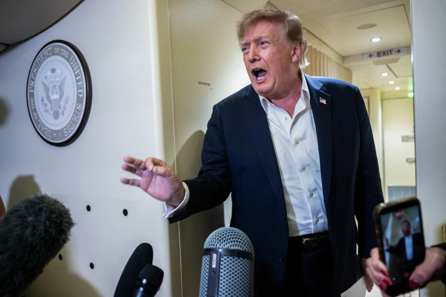 US President Donald Trump speaks to the press aboard Air Force One while flying to Joint Base Andrews, Maryland from Ireland on Sept., 13, 2026.