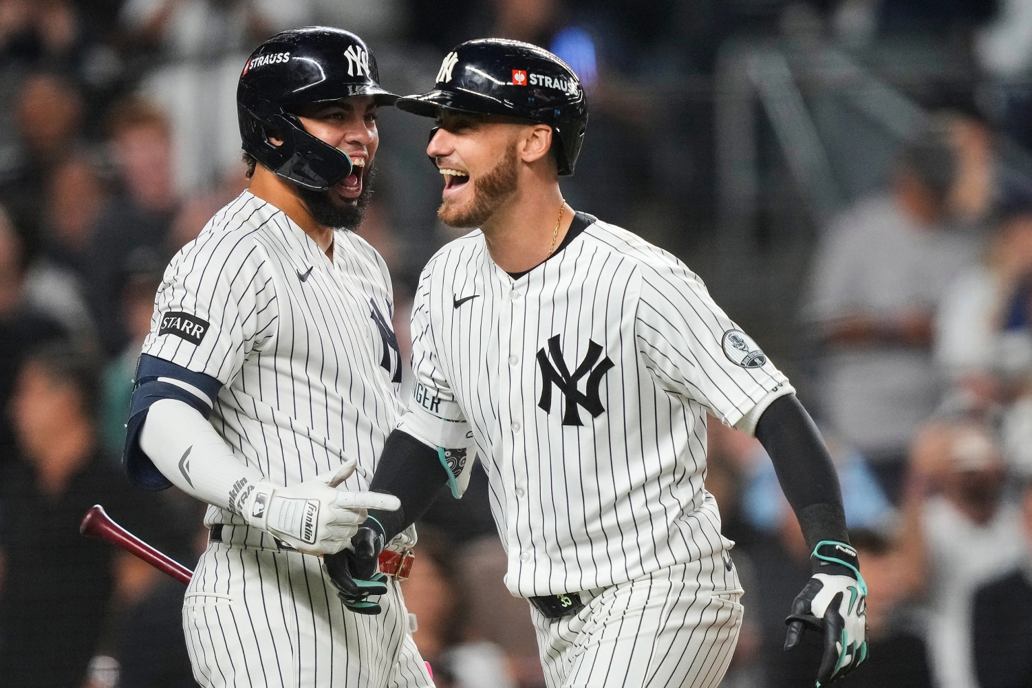 New York Yankees' Cody Bellinger, right, celebrates with teammate Luis García Jr., left, after hitting a three-run home run against the Boston Red Sox during the sixth inning in Game 2 of baseball's American League Wild Card Series, Wednesday, Sept. 30, 2026, in New York.