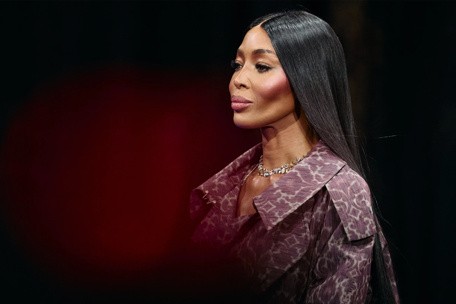 British model Naomi Campbell presents a creation from Burberry 's Womenswear Fall-Winter 2025-2026 fashion show collection, during London Fashion Week, in London, on February 24, 2025.