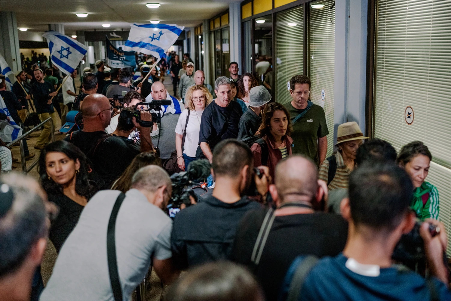 Passengers leave Ben Gurion Airport in Tzafria, Israel, on Wednesday