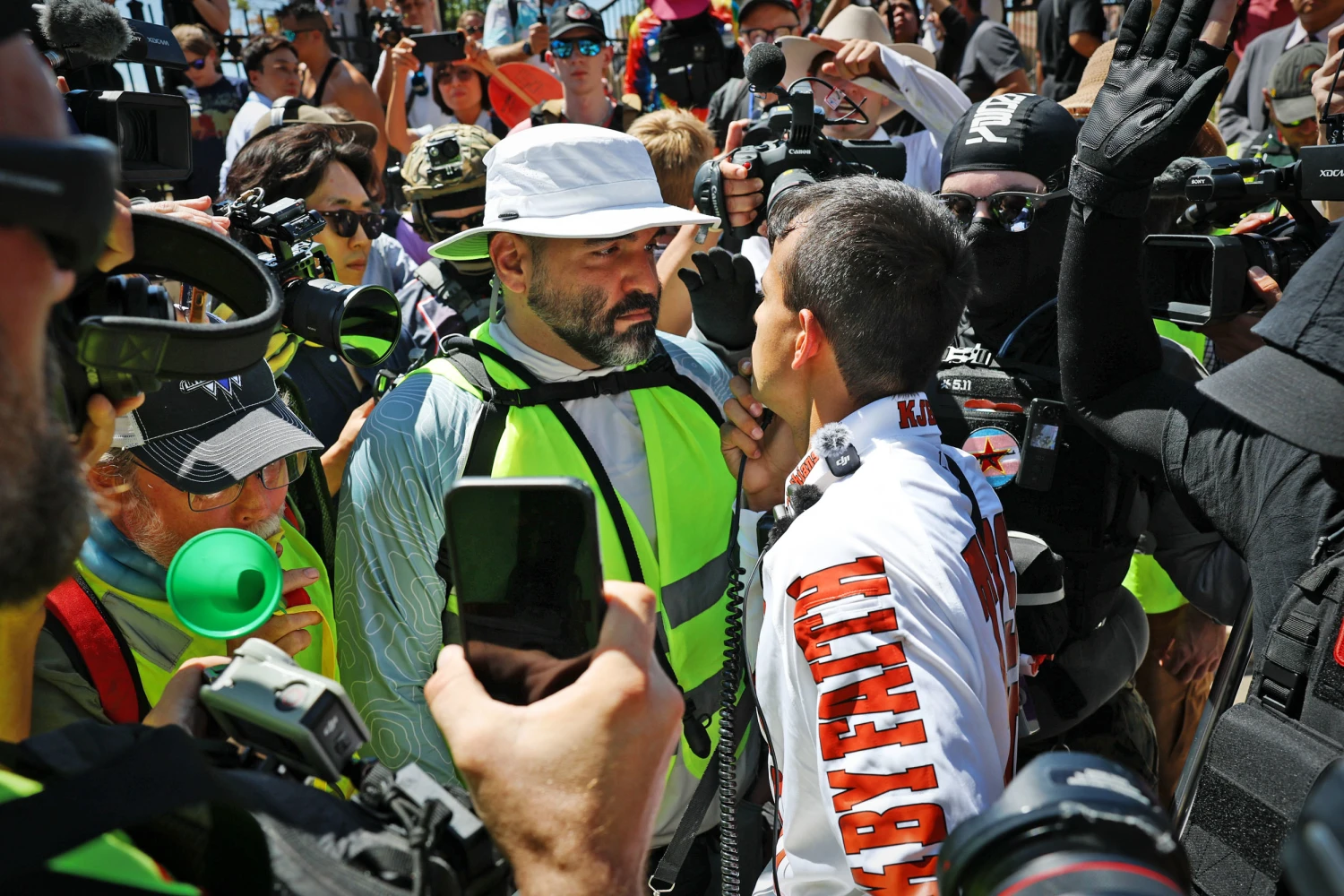 Demonstrators and counter-protesters confront each other outside the Republican Midterm Convention in Dallas.