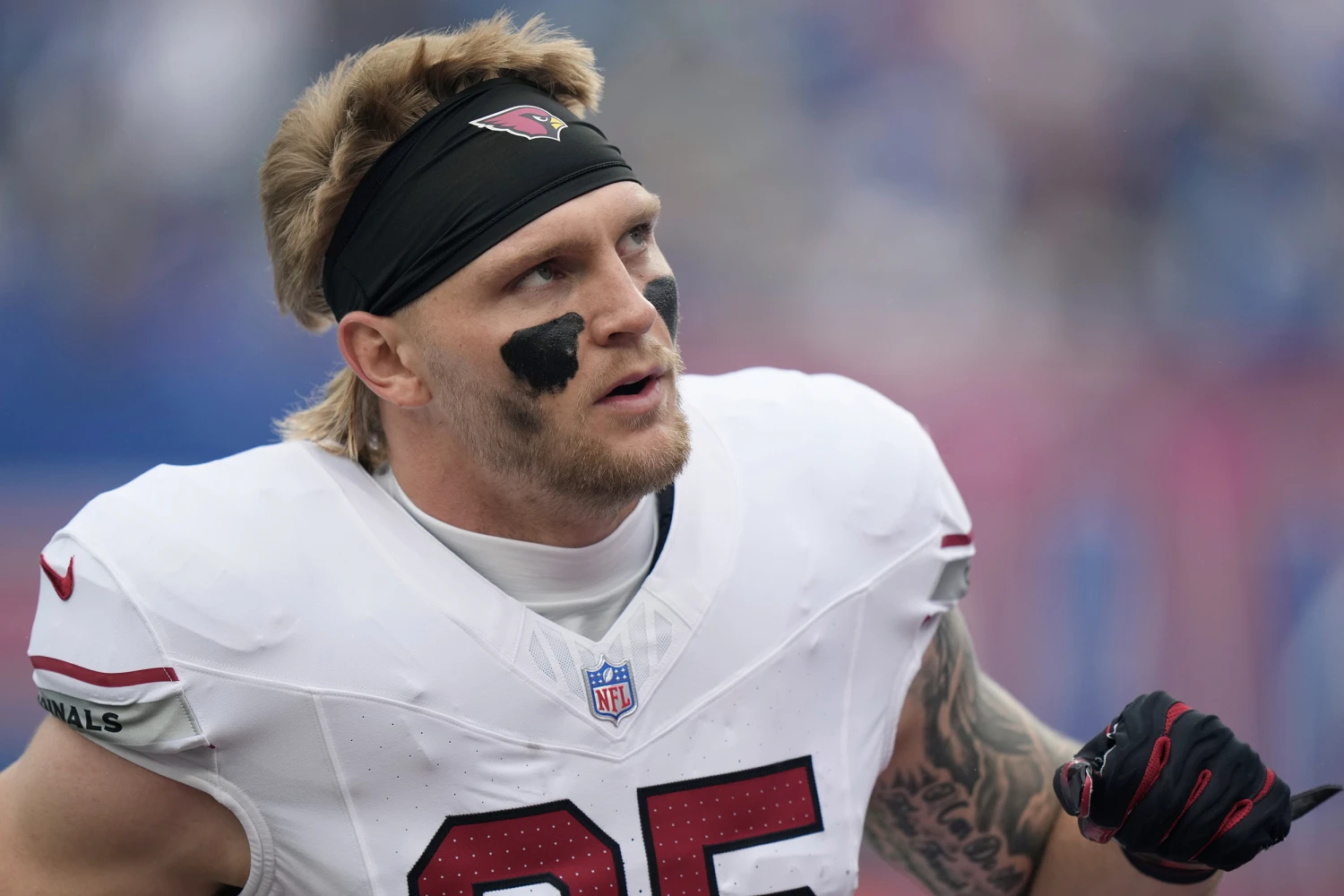 Arizona Cardinals tight end Trey McBride pauses on the field during an NFL football game against the New York Giants, in East Rutherford, N.J. on Oct. 4, 2026.