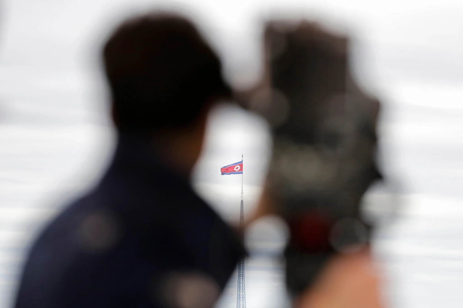 A North Korean flag flutters in the wind atop a 160-meter tower in North Korea's village Gijungdong as seen from the Taesungdong freedom village inside the demilitarized zone in Paju, South Korea on April 24, 2018.